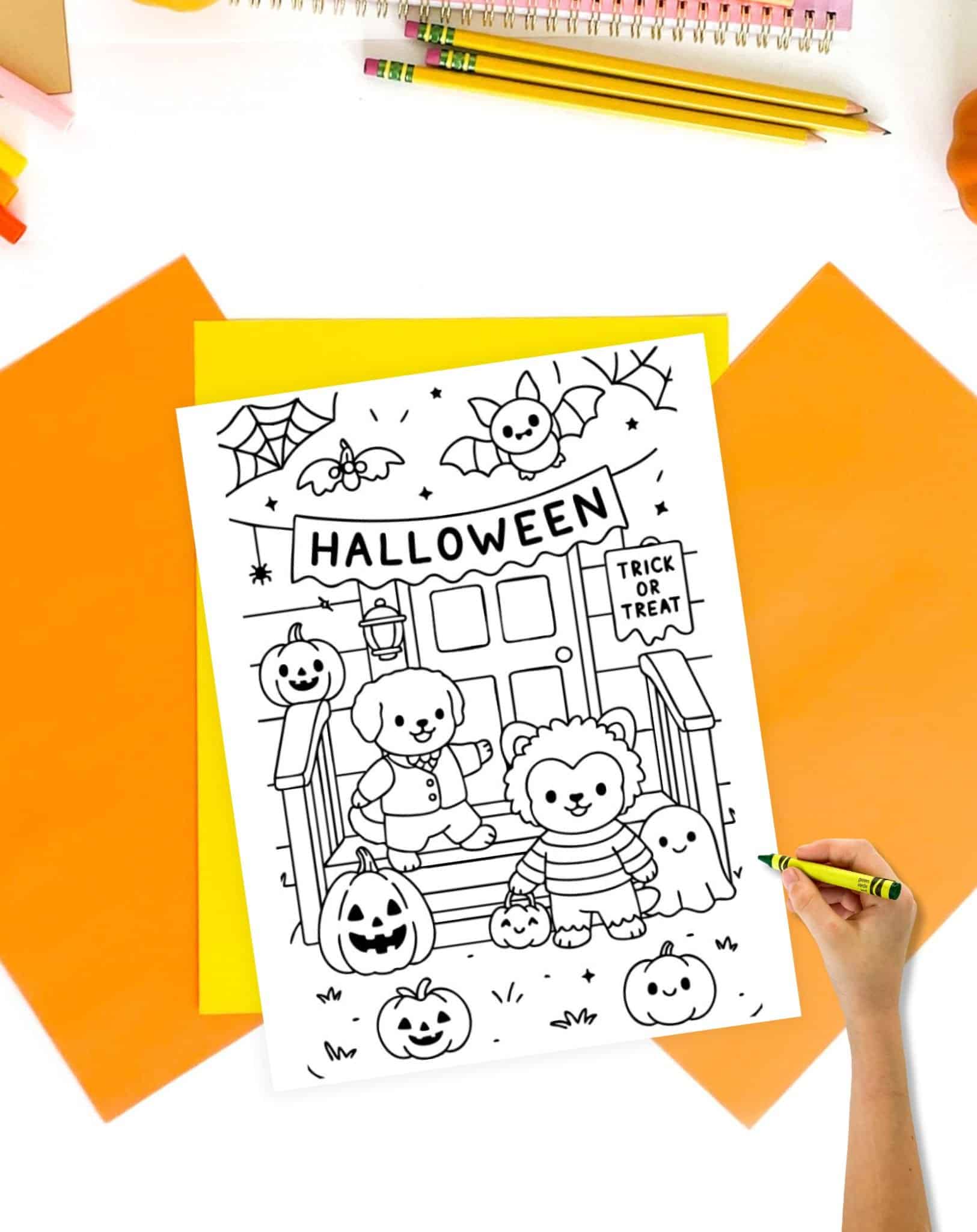 A hand is coloring a black-and-white printable Halloween coloring page featuring cartoon animals, pumpkins, and a "Trick or Treat" sign, set against a festive background.
