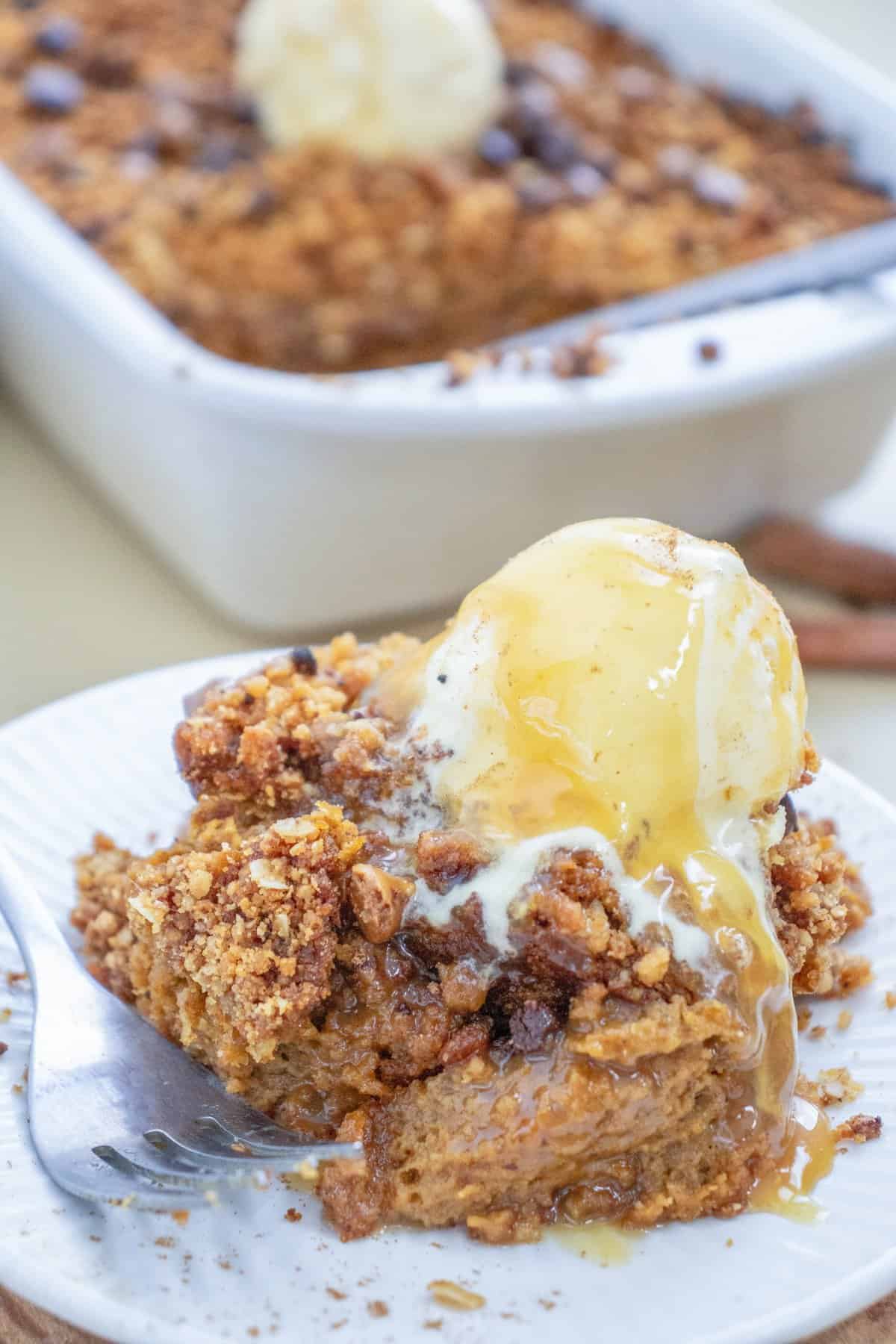 a plate with pumpkin crisp and ice cream on top