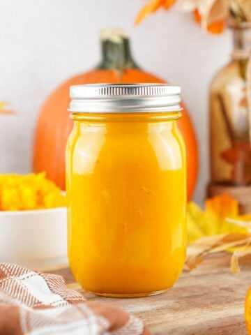 a glass jar of homemade pumpkin puree