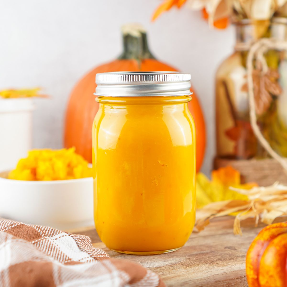 a glass jar of homemade pumpkin puree