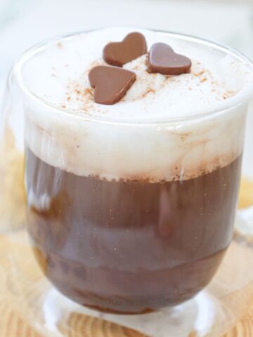 a glass mug of pumpkin spice hot chocoalte