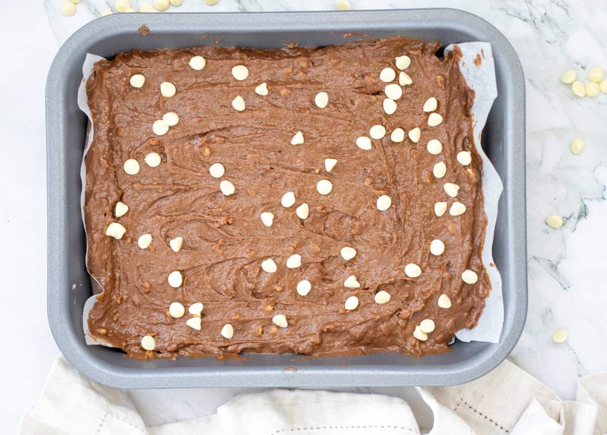 a pan of sweet potato brownies ready to bake