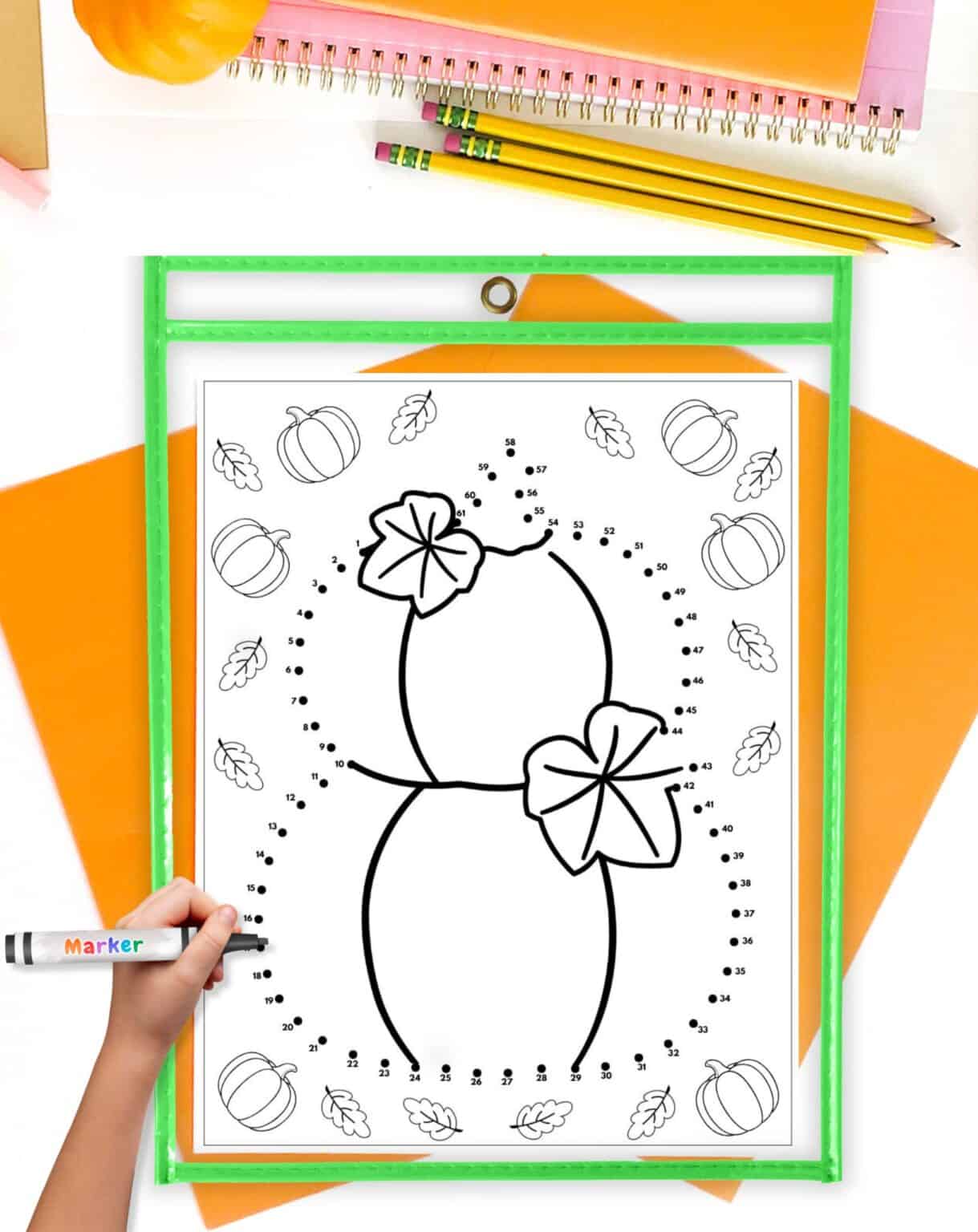 a pumpkin connect the dots page in a dry erase pocket