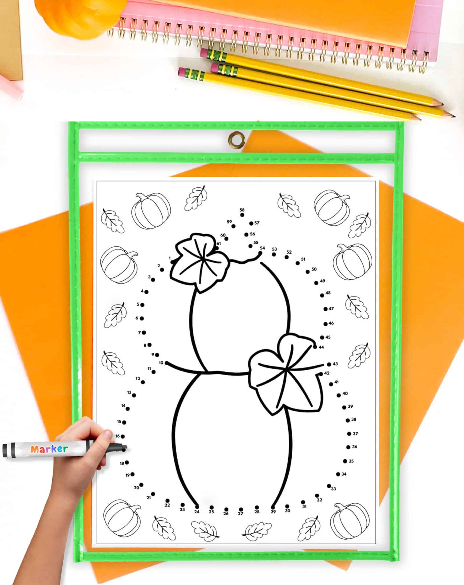 a pumpkin connect the dots page in a dry erase pocket 