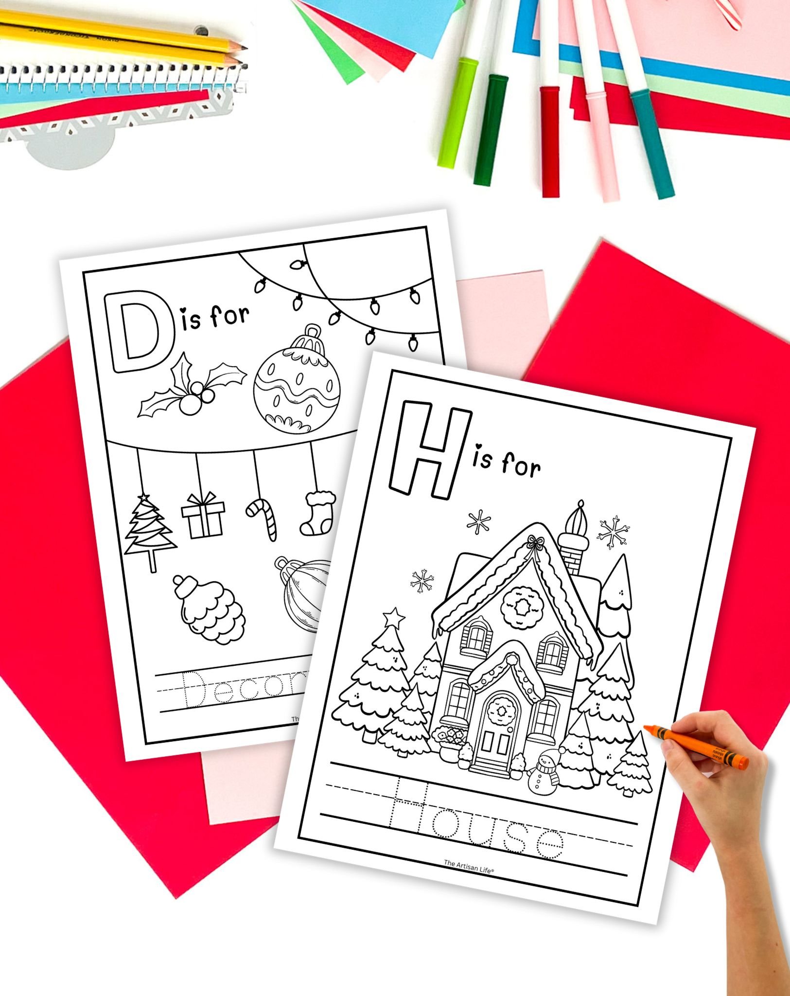 a coloring page with "H is for House" and another with "D is for decoration" on a table with colorful Christmas themed stationary items