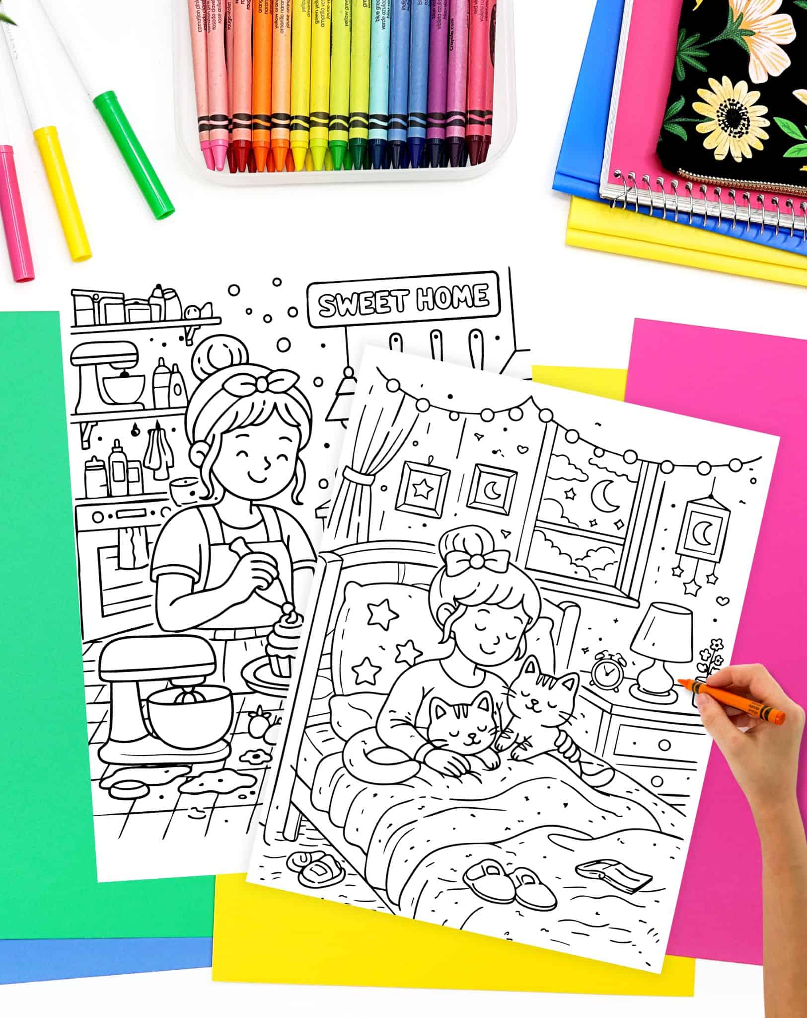 a hadn't with an orange crayon preparing to color a coloring page showing a woman cuddling two cats in bed