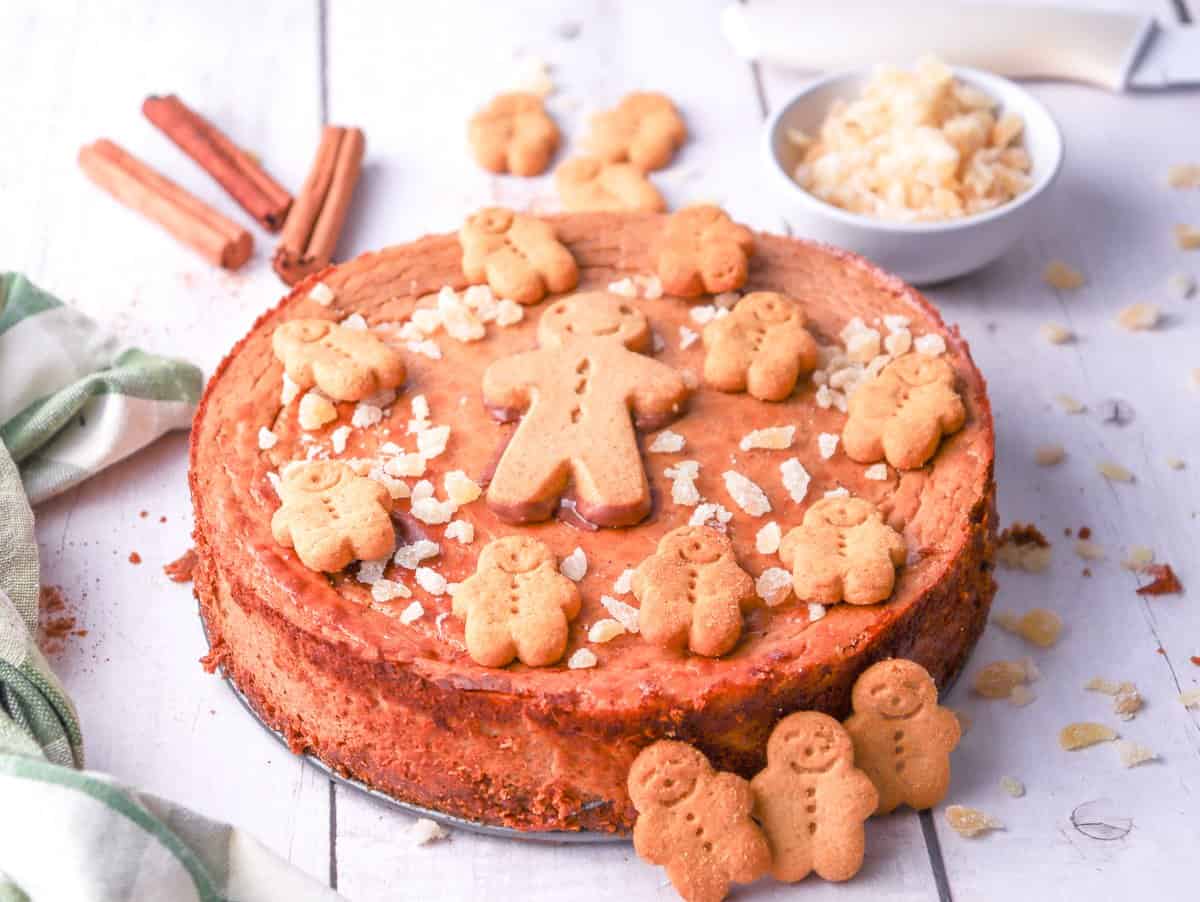 a gingerbread peanut butter cheesecake with gingerbread man cookies