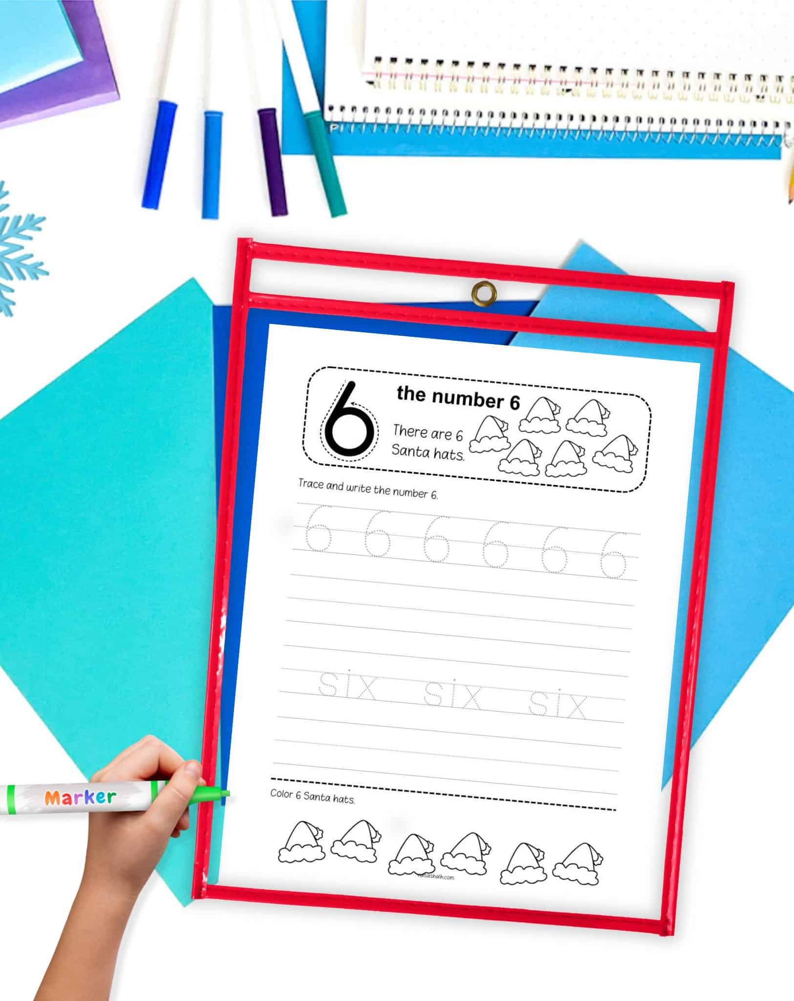 a number six tracing page with a Christmas theme in a dry erase pocket