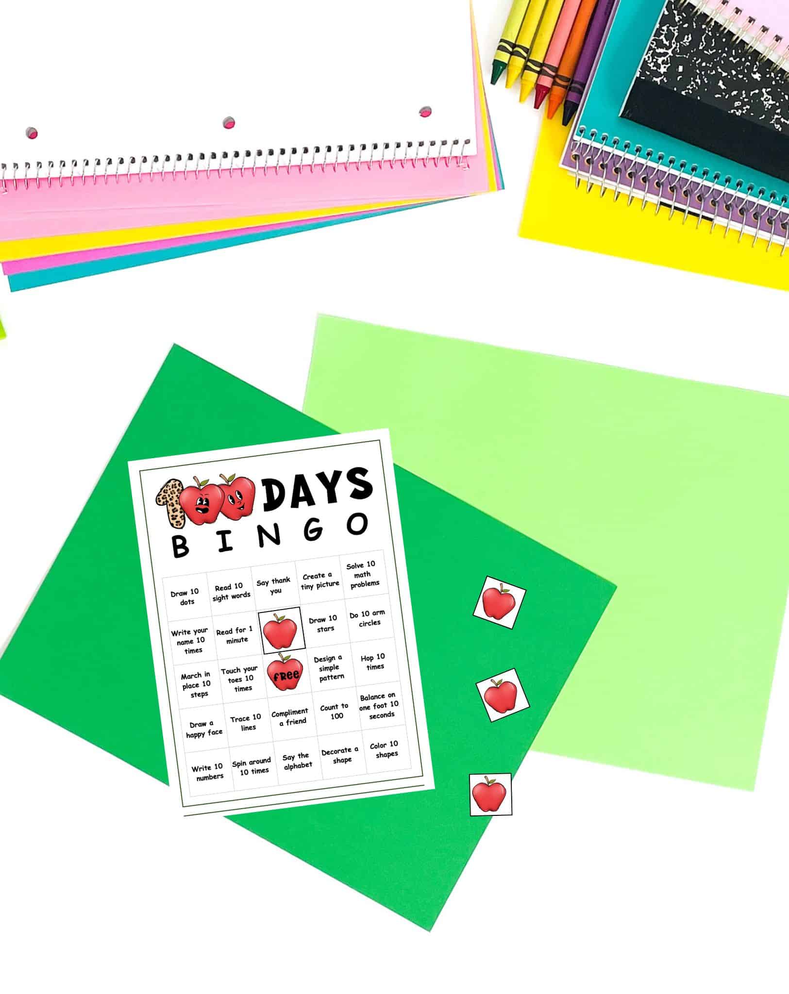 a preview of a 100th day of school bingo card with apple bingo markers
