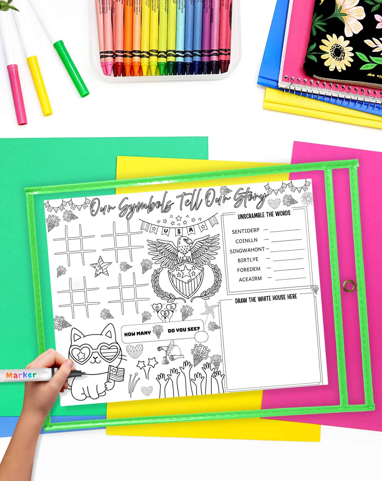 a hadn't with a marker preparing to use a Presidents Day themed activity placemat