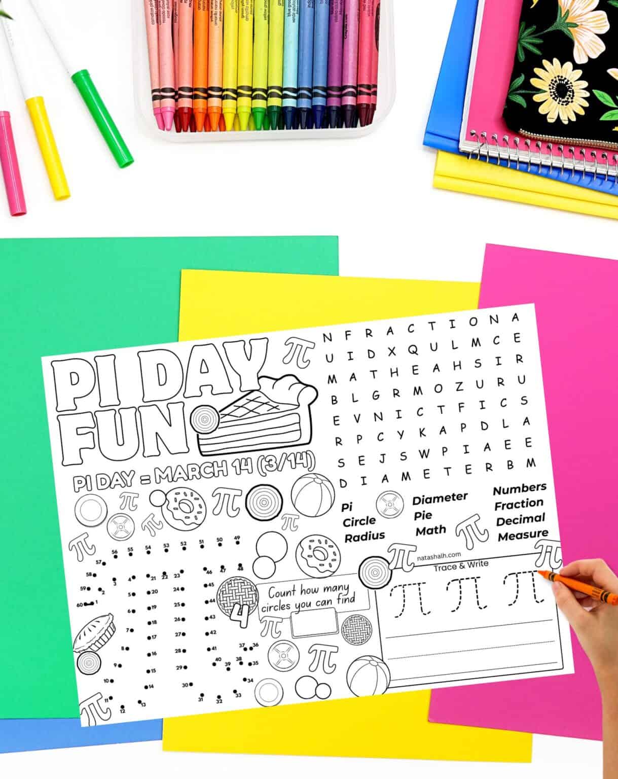 a child's hand with a crayon preparing to use a pi day activity placemat
