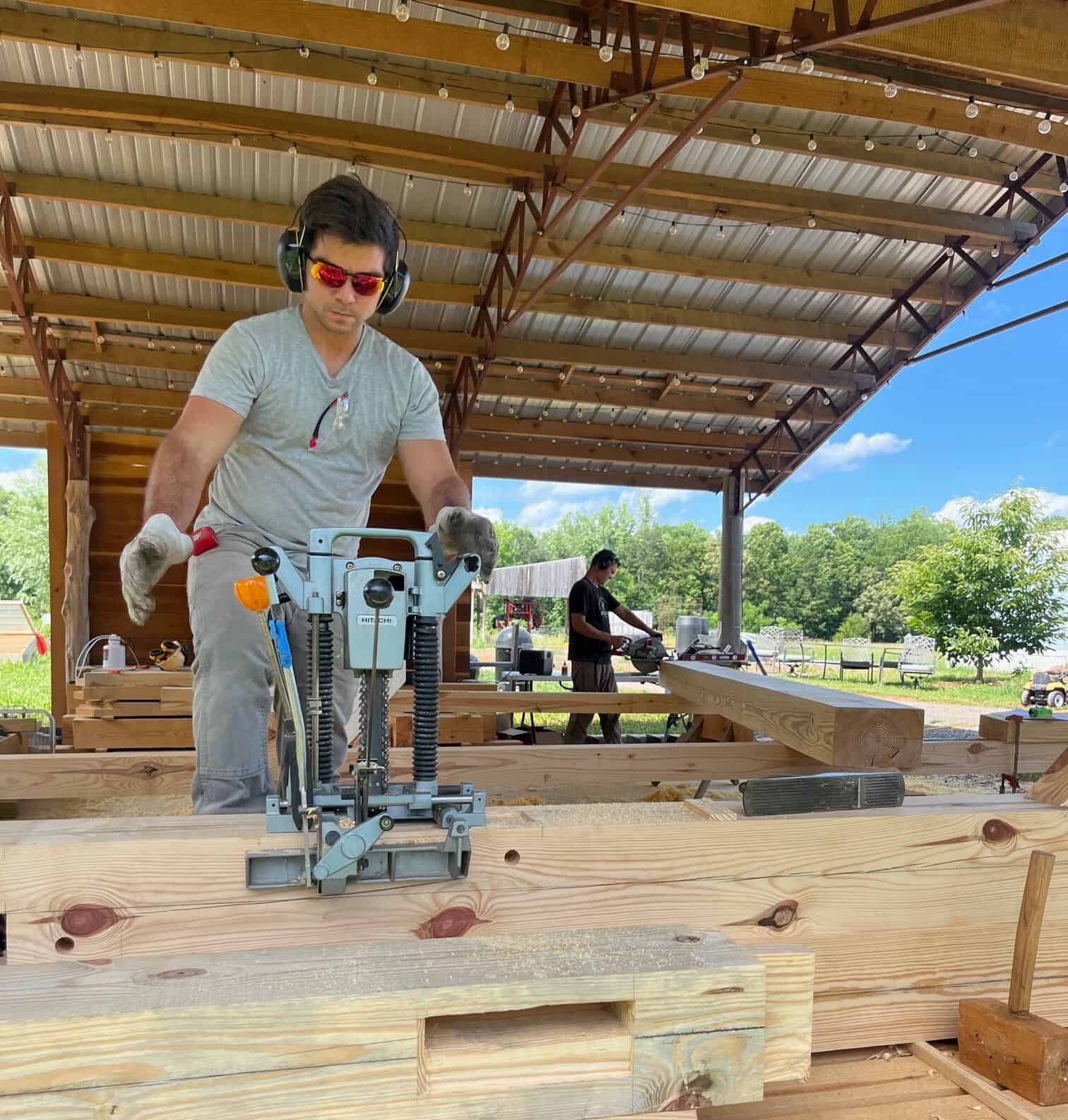 a man using a hitachi chain mortiser