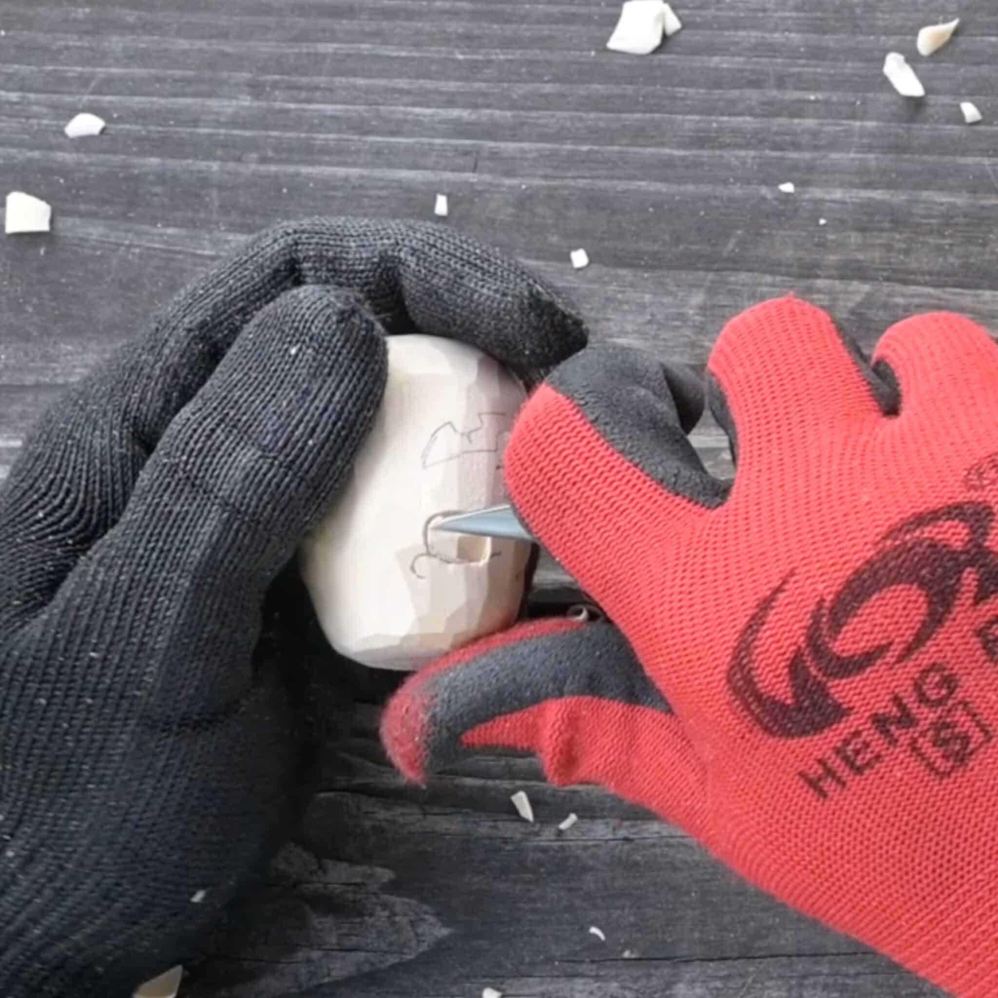 carving the eyes of a wood pupmkin