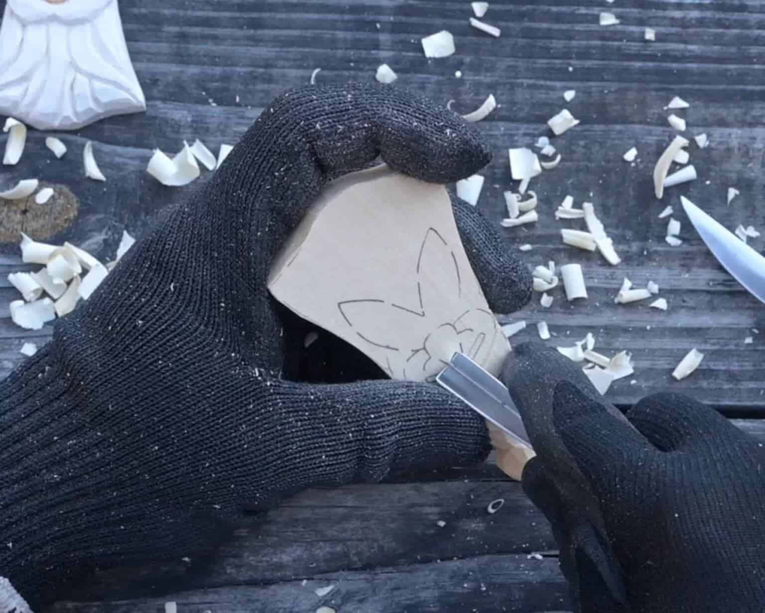 carving the nose of a wood santa