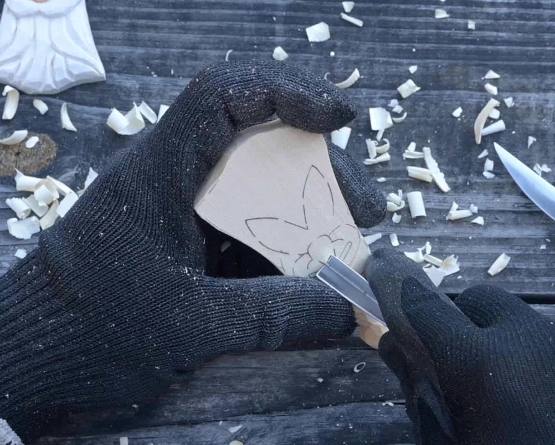 carving the nose of a wood santa