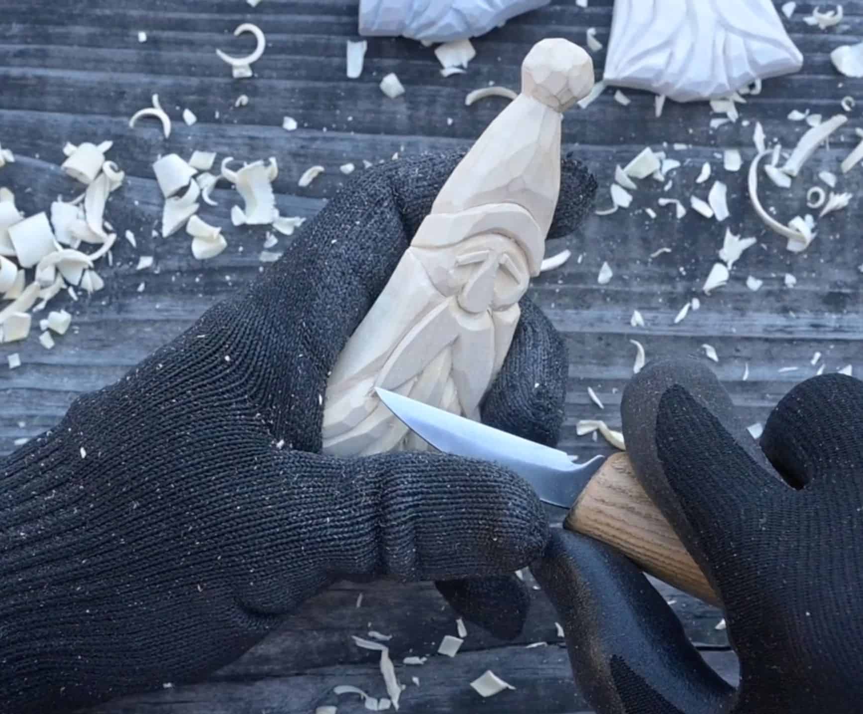 carving the beard of a wood santa