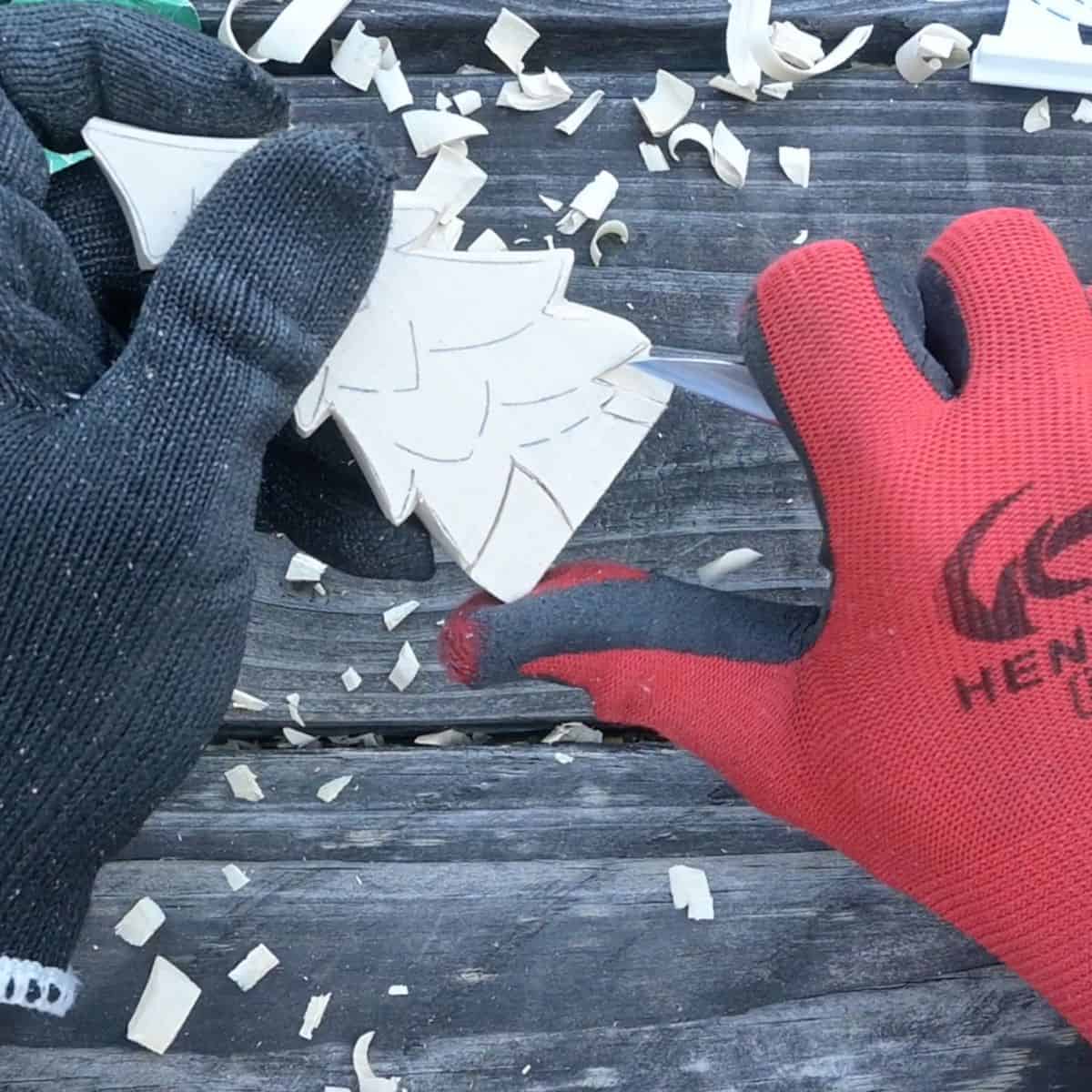 carving a wood christmas tree