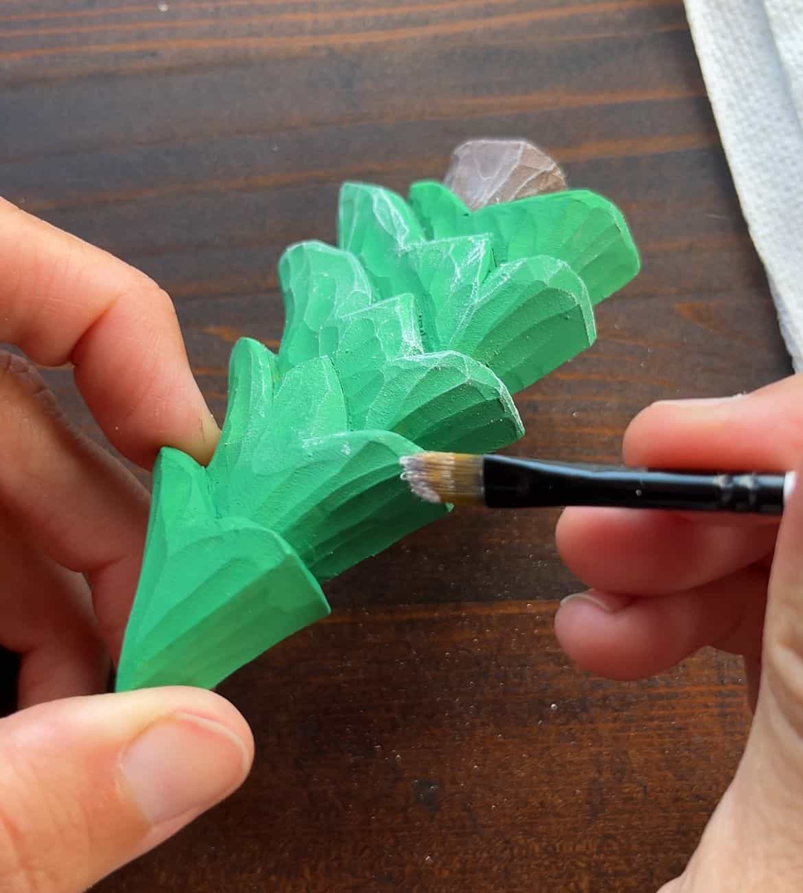 dry brushing a wood christmas tree carving