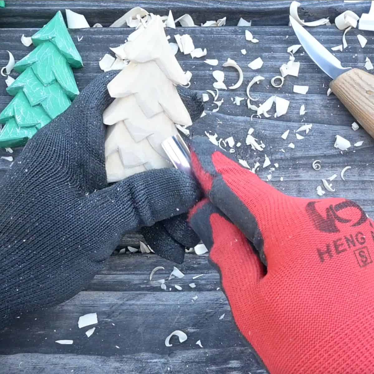using a gouge on a wood carved christmas tree