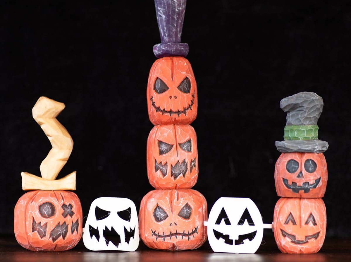 six wood carved pumpkins with flexible face stencils