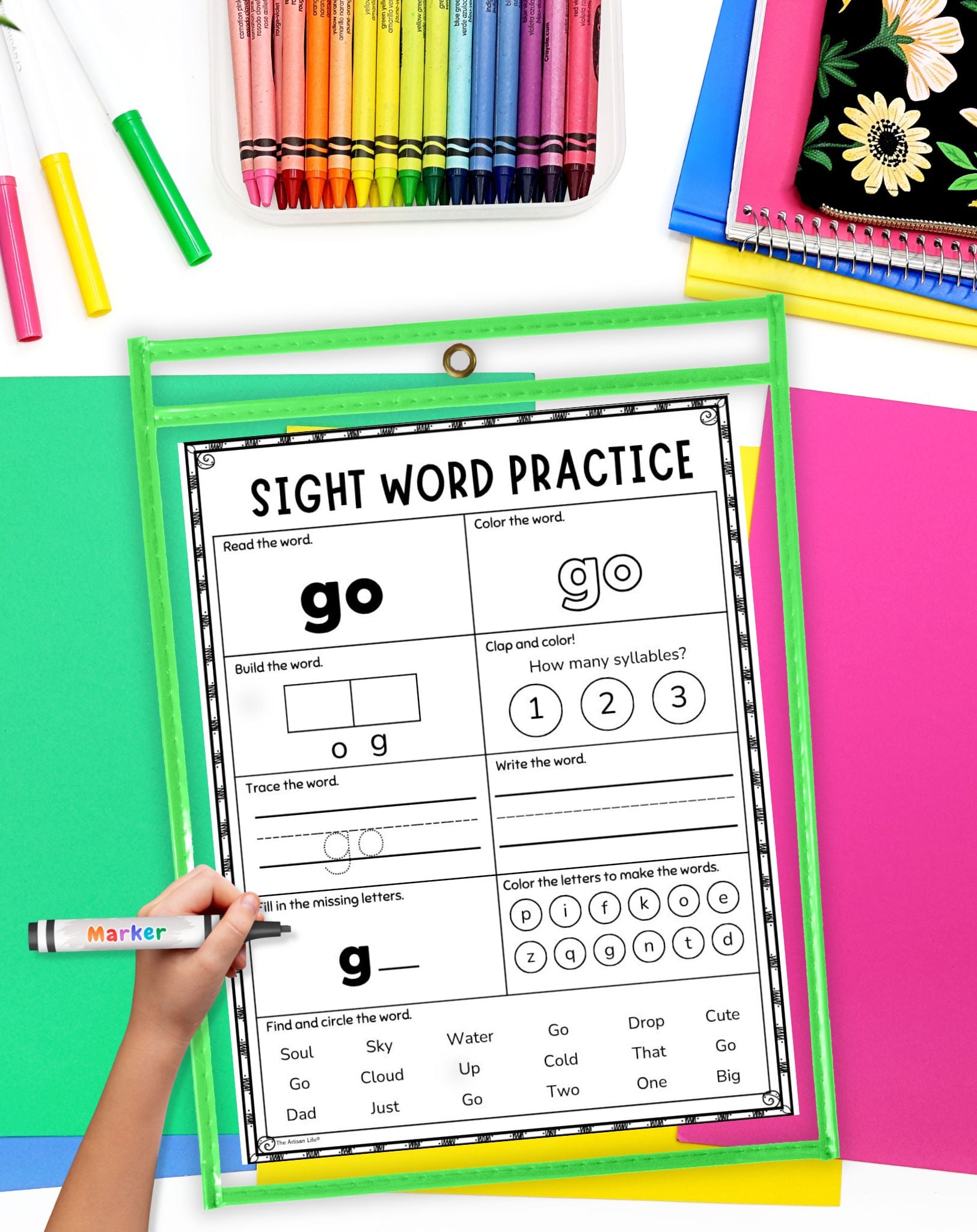 a hand with a marker preparing to use a sight word worksheet in a page protector