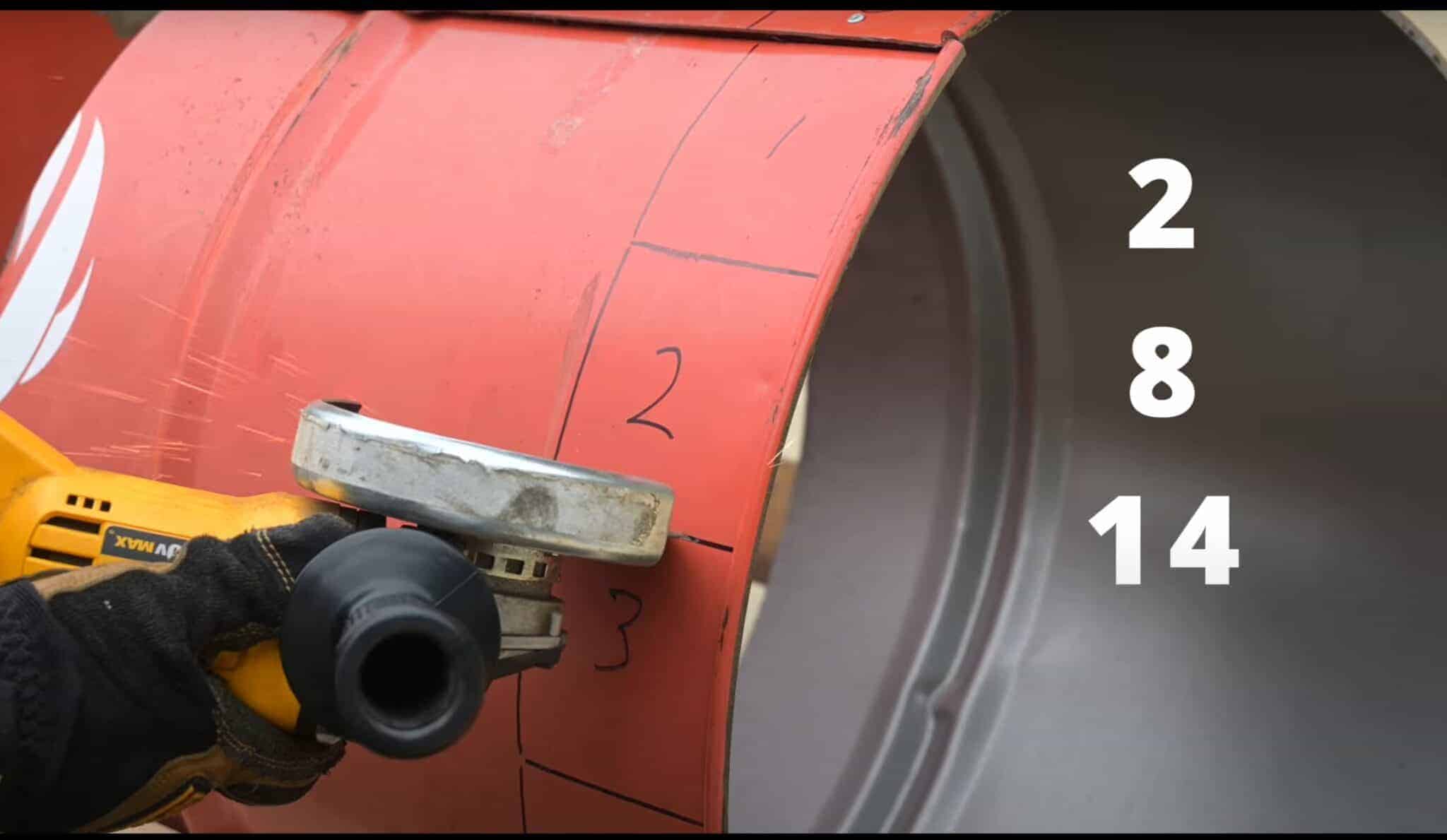 Photo is of a person cutting squares 2, 8, and 14 in a 55 gallon drum to make legs for a firepit.