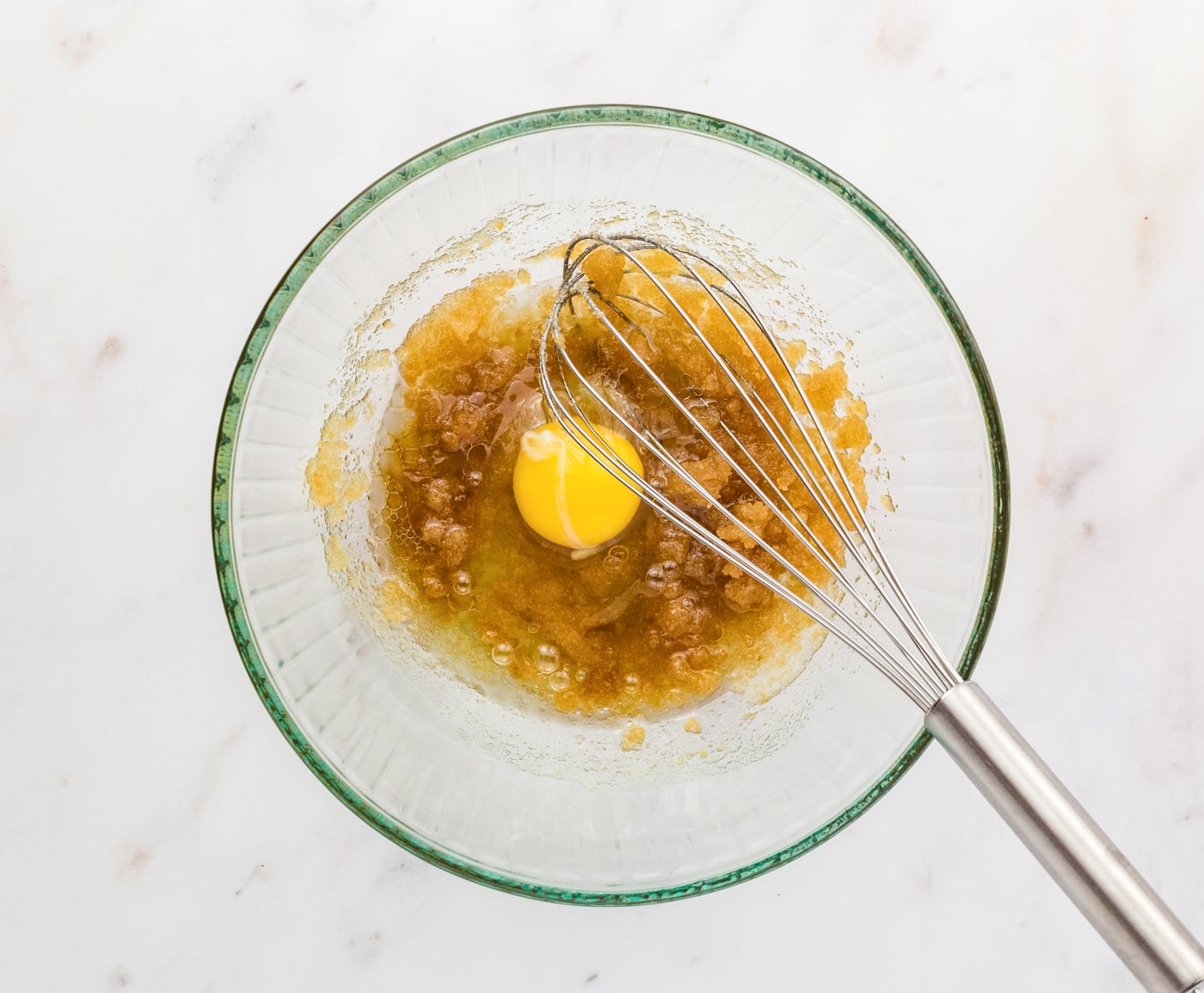 mixing sugar and an egg together