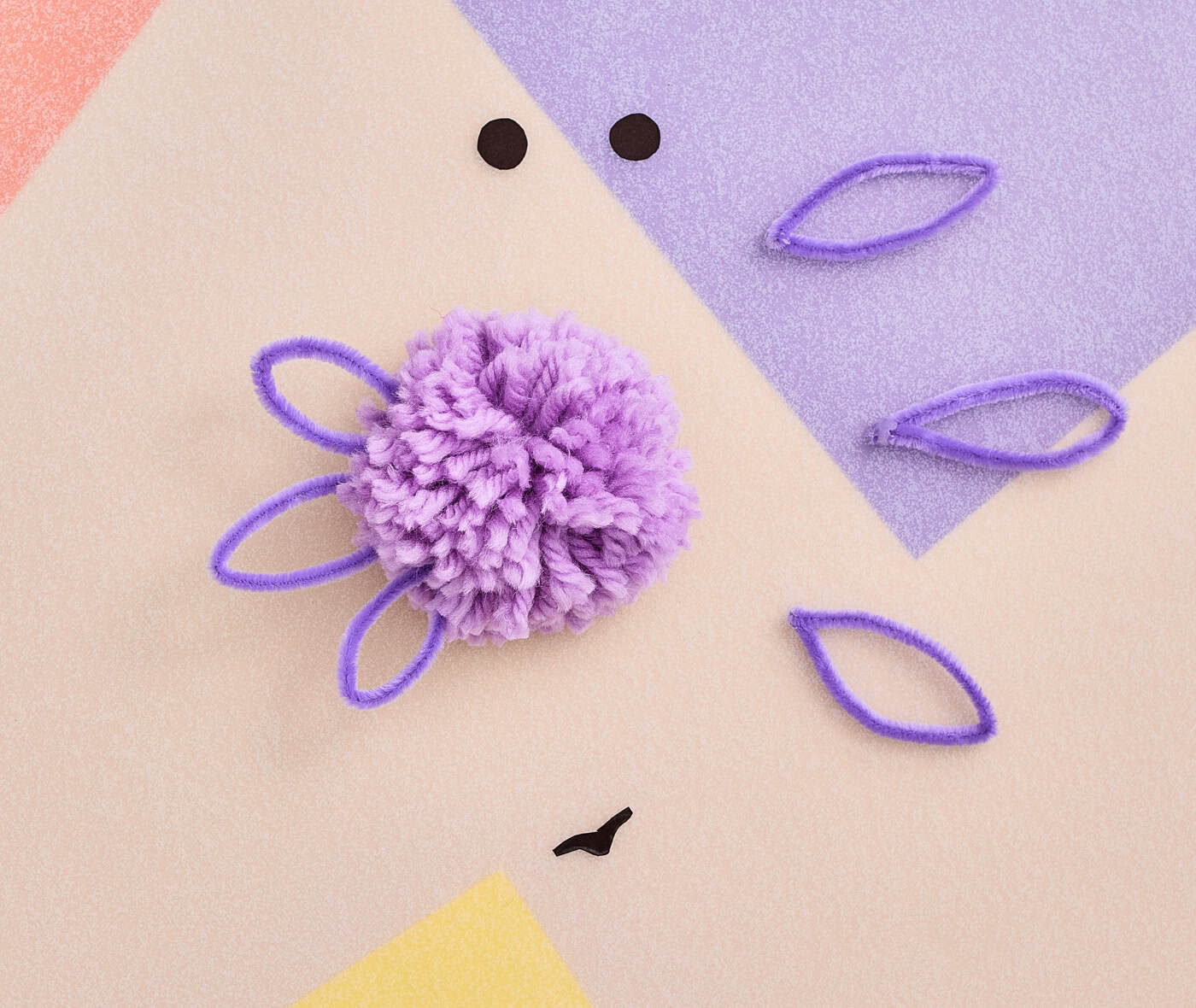 putting pipe cleaner gills on an axolotl craft