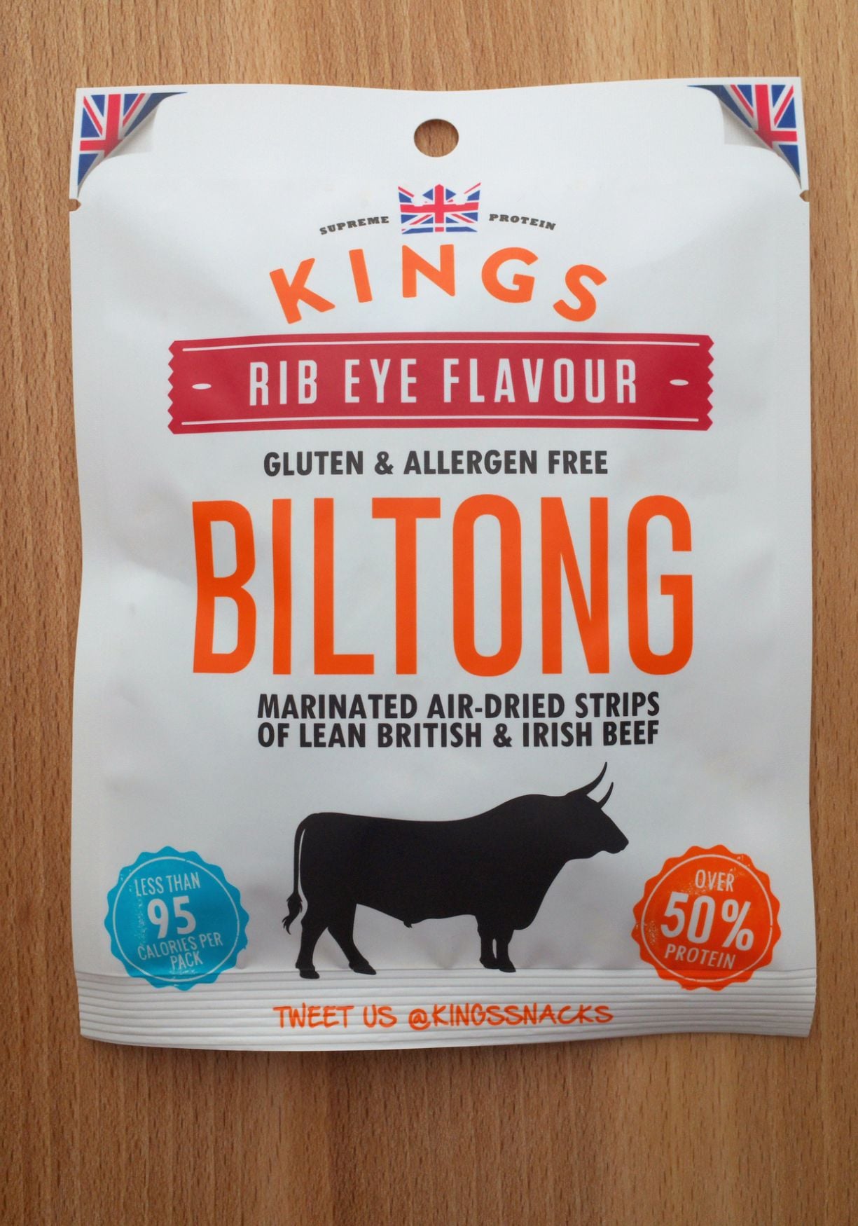 a bag of King's brand biltong beef jerky on a wood background
