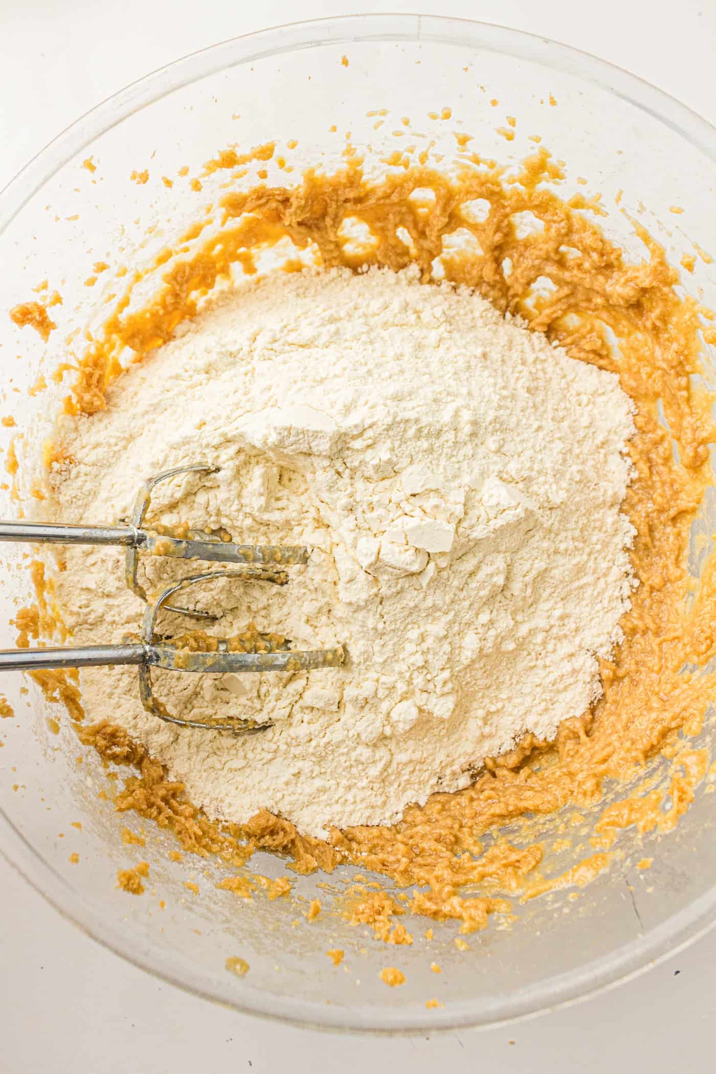 combining wet and dry ingredients for a bakery style sourdough discard chocolate chip cookie