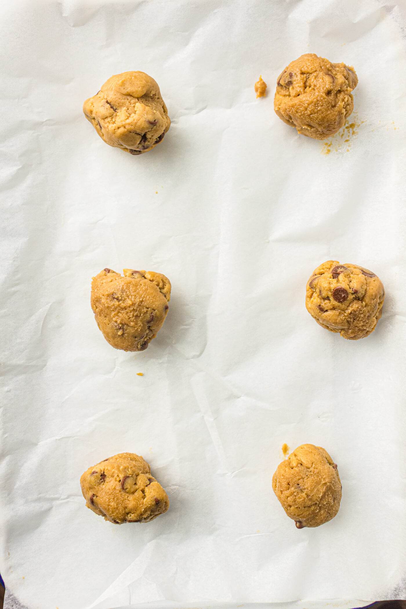 bakery style sourdough discard chocolate chip cookies unbaked on a tray
