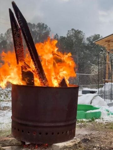 a photo of a smokeless fire pit burning on a winter day