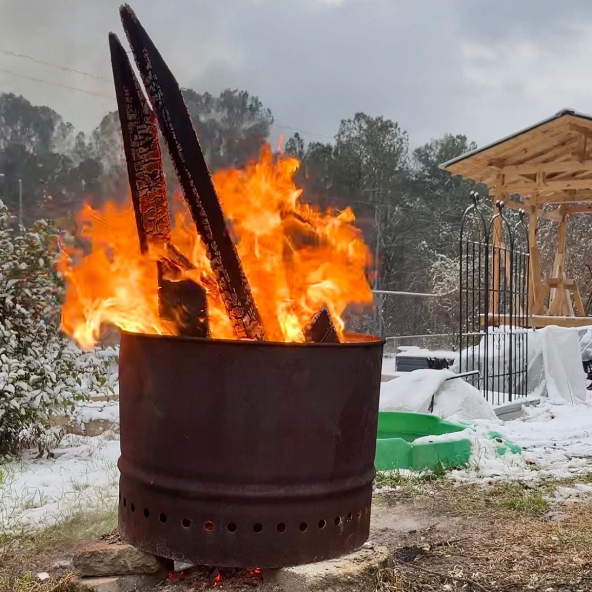 a photo of a smokeless fire pit burning on a winter day