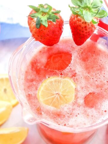 a pitcher of strawberry lemonade