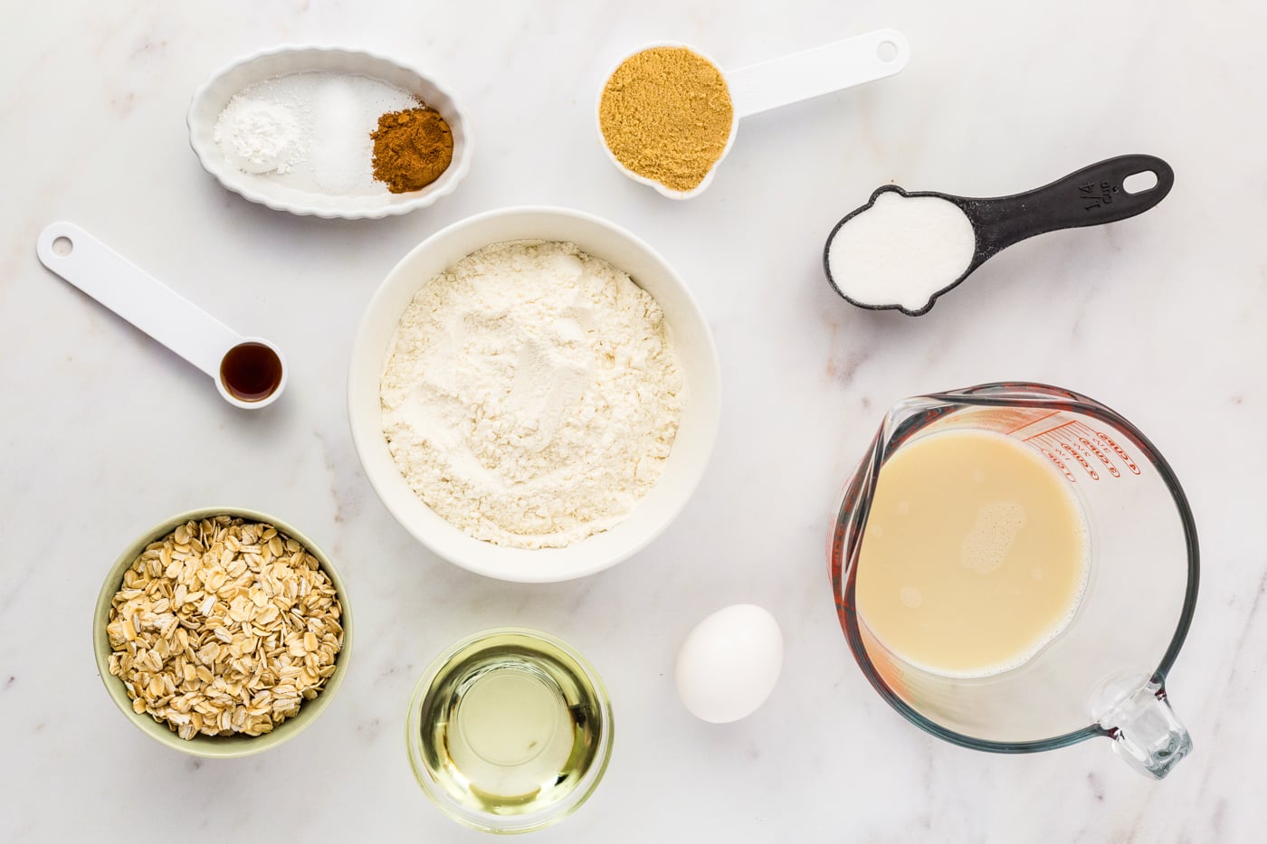 ingredients for gluten free oatmeal muffins on a marble counter