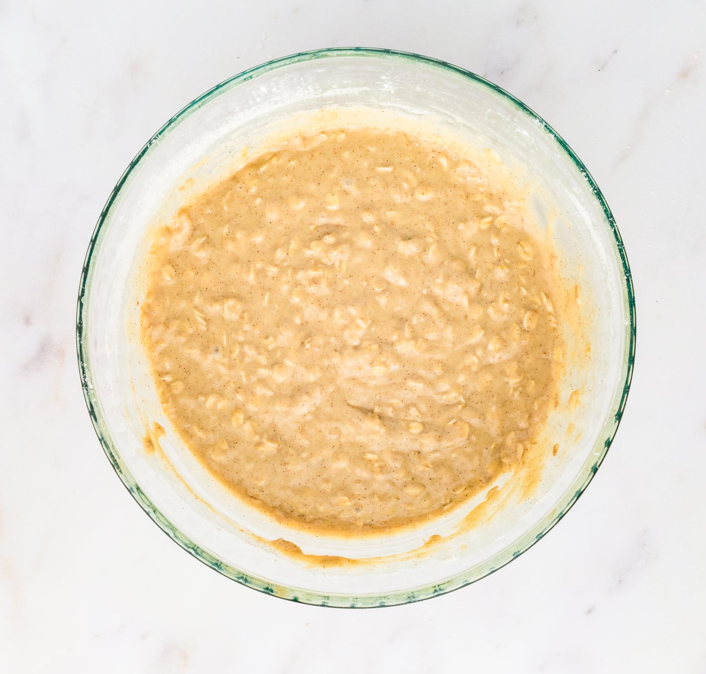 mixed ingredients for a batch of gluten free oatmeal muffins