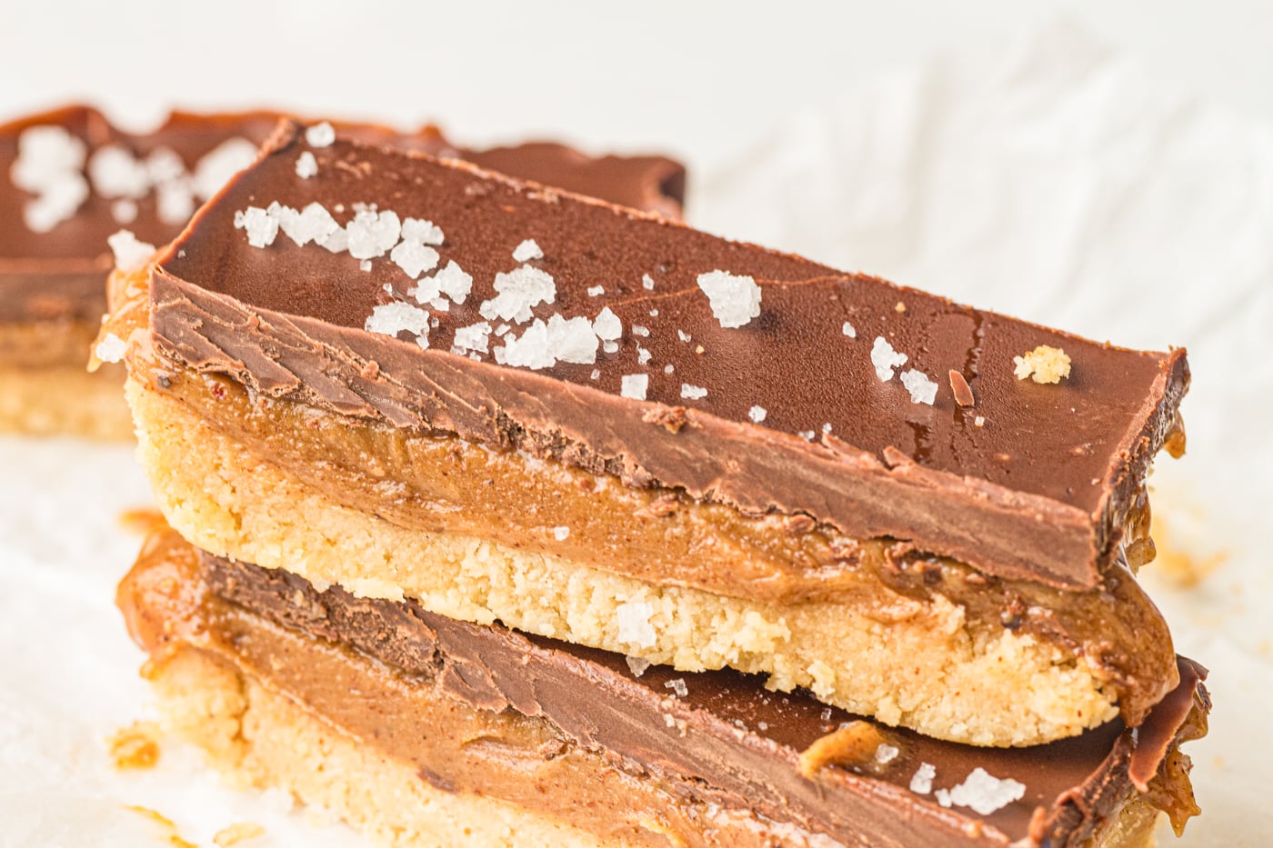copycat twix bars with flaky salt that are gluten free and dairy free, made with almond flour and almond butter