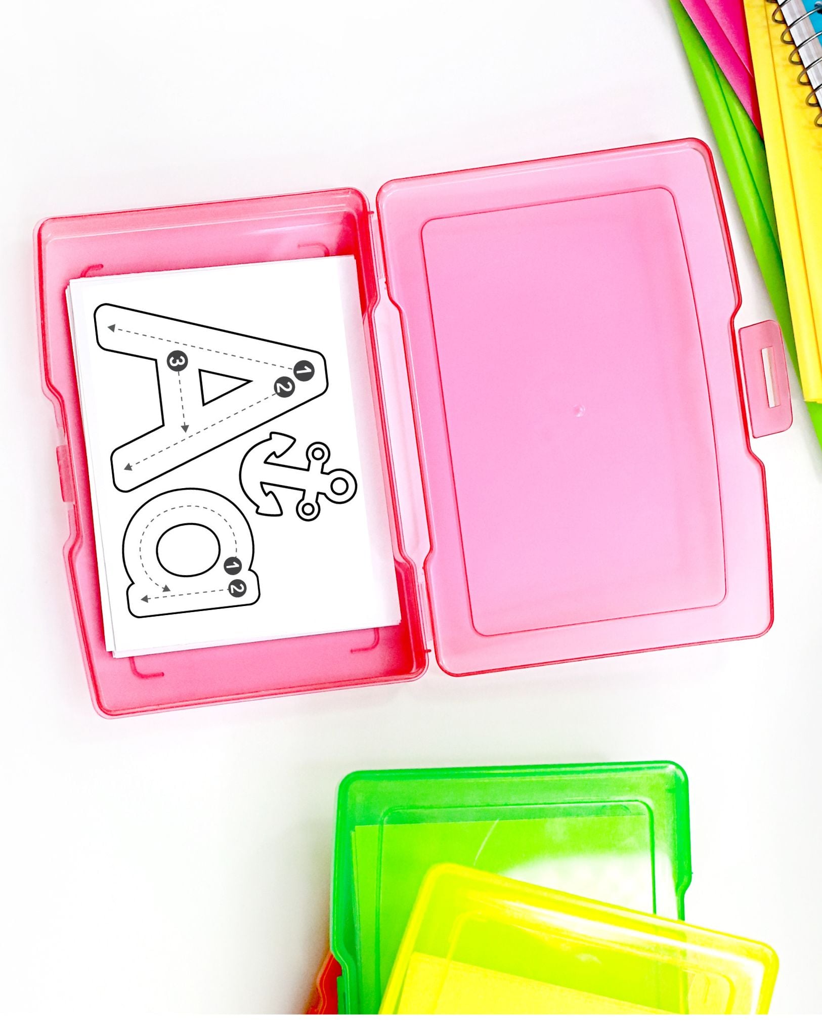 a pink task box with a letter a tracing card