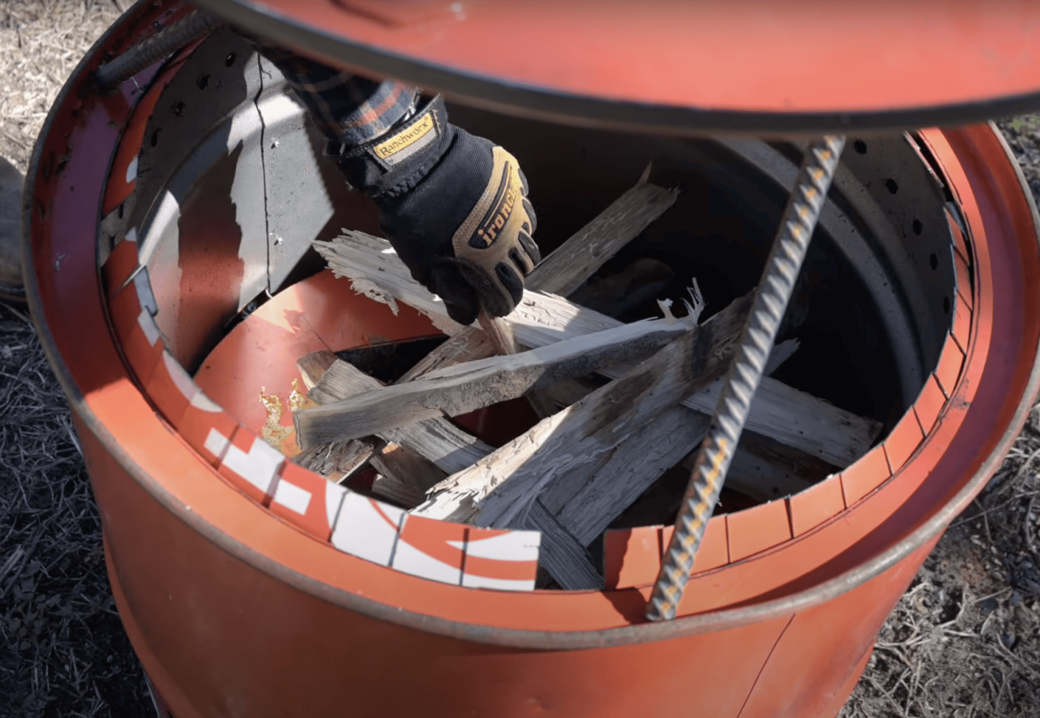 wood stacked inside a smokeless fire pit for burning