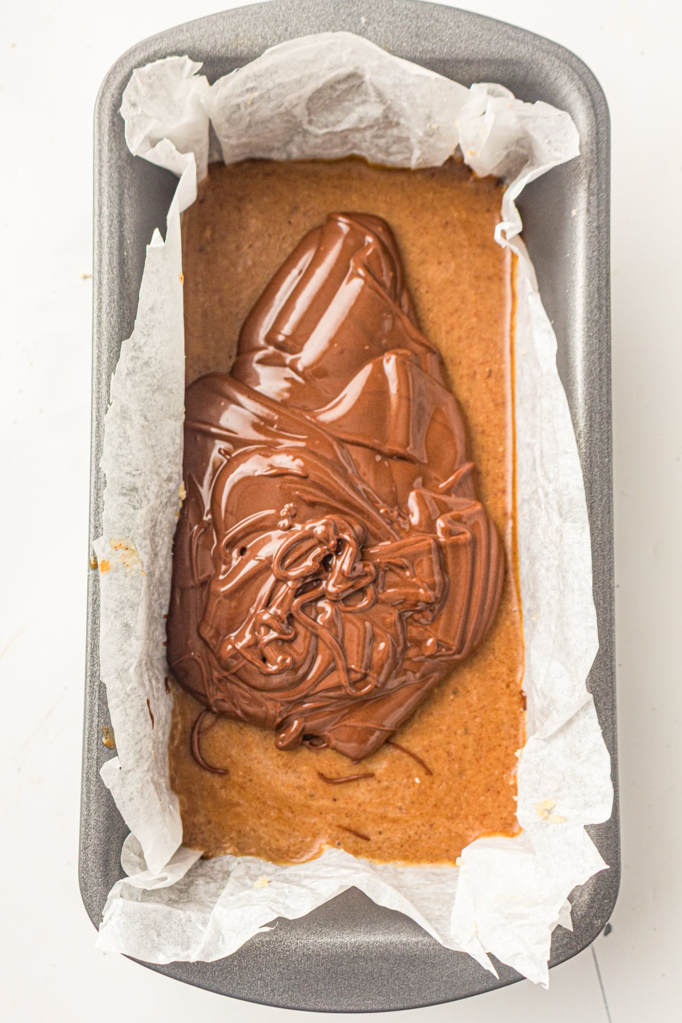 melted chocolate in a pan of gluten free copycat twix bars