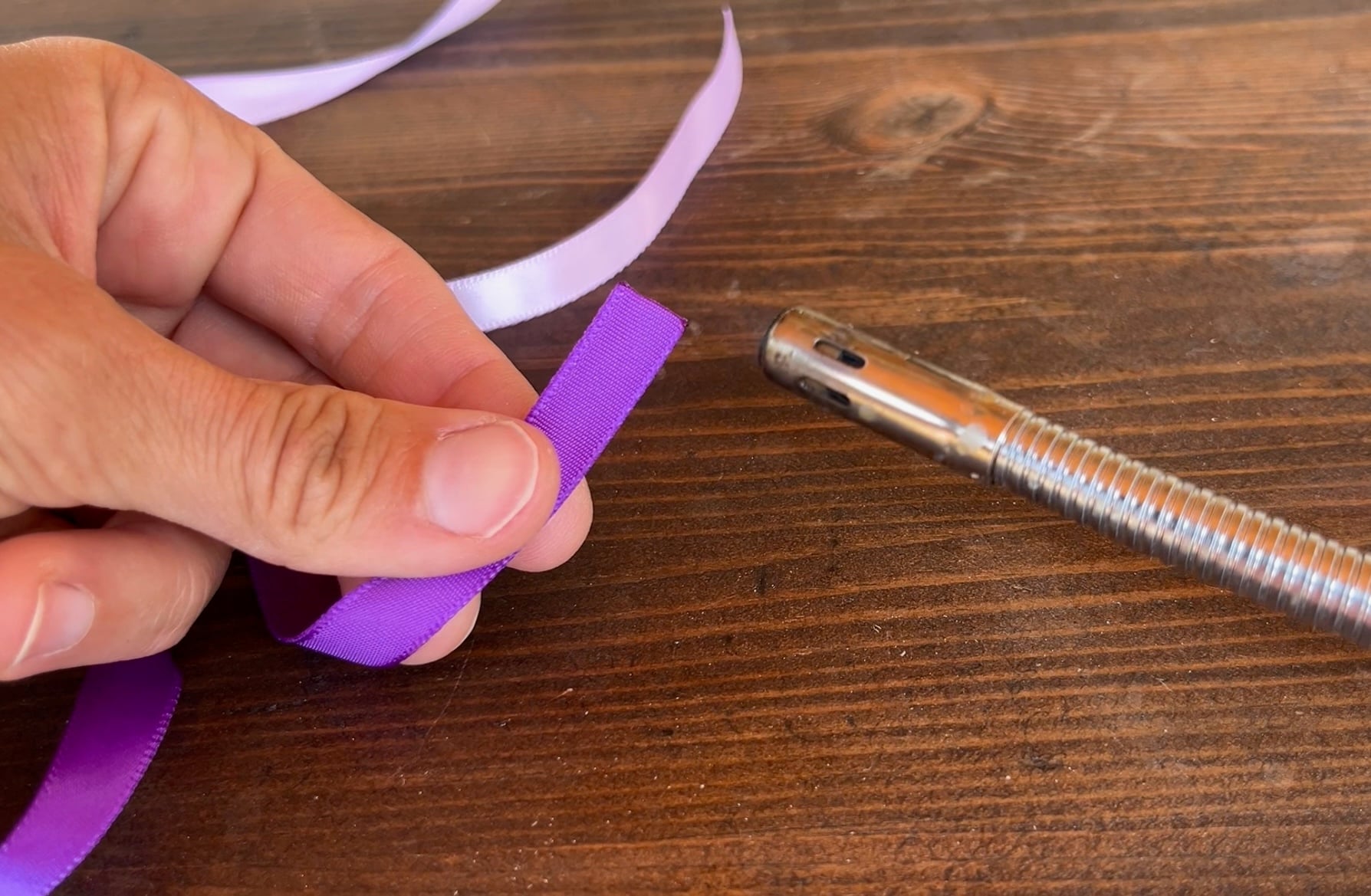 singing the ends of a piece of ribbon