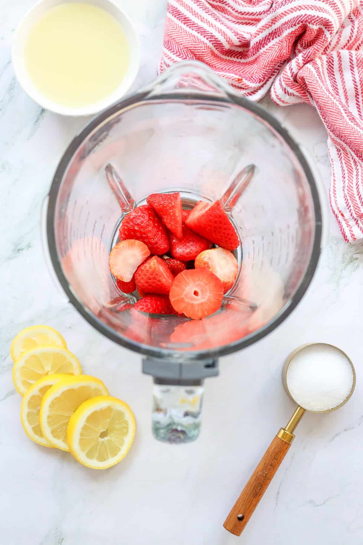 strawberries in a bender to puree for lemonade