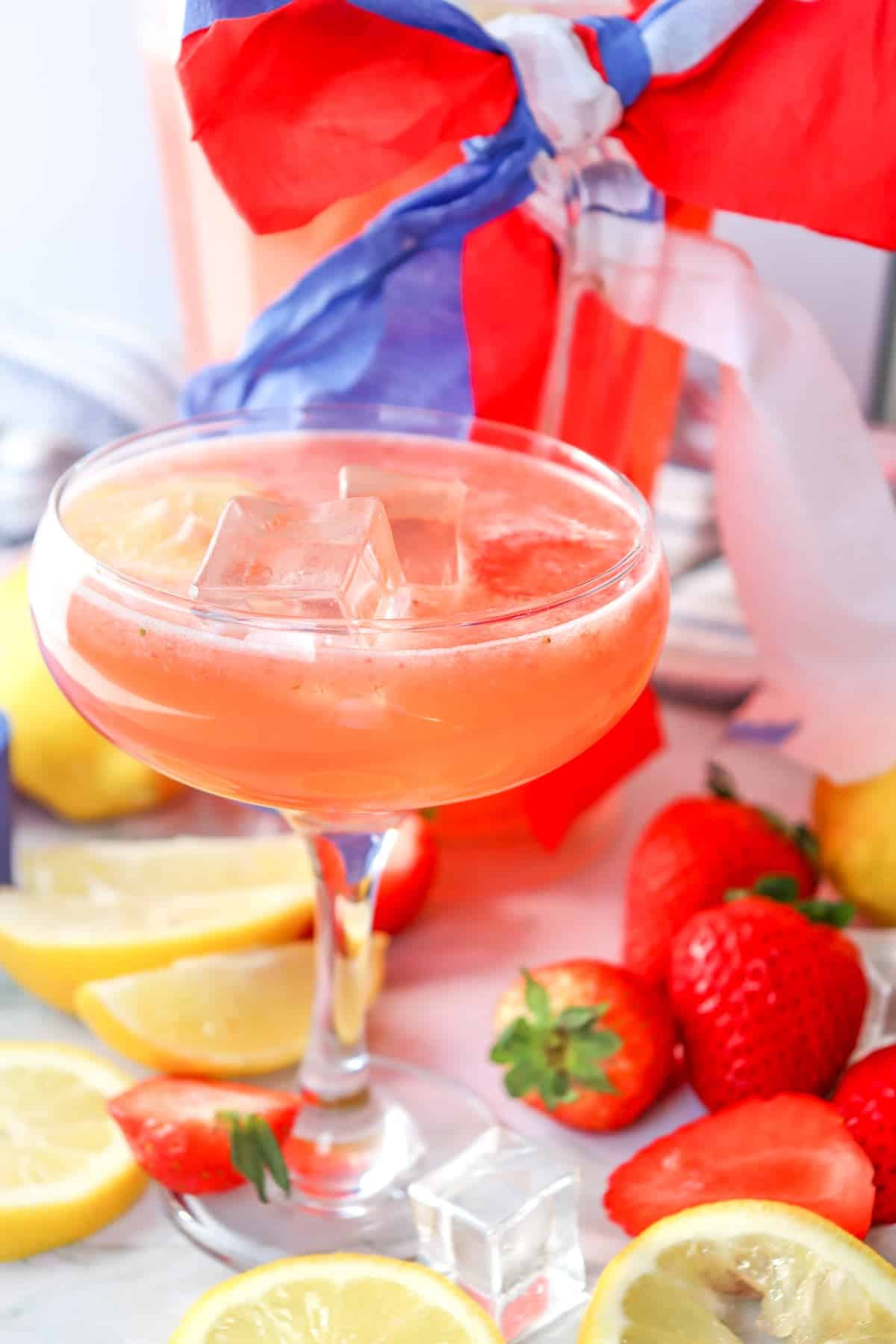 a martini glass with strawberry lemonade