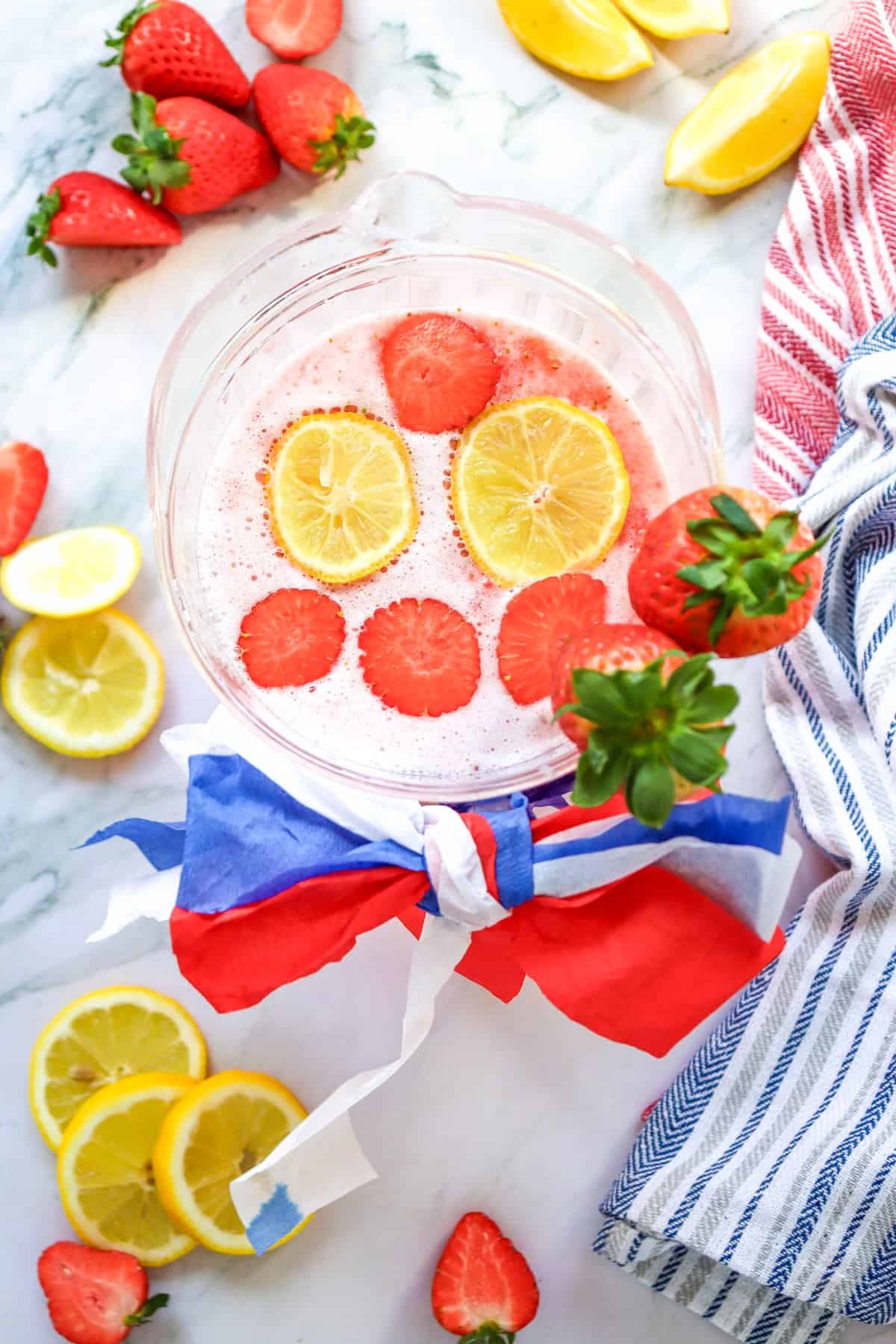 a top down picture of a pitcher of strawberry lemonade