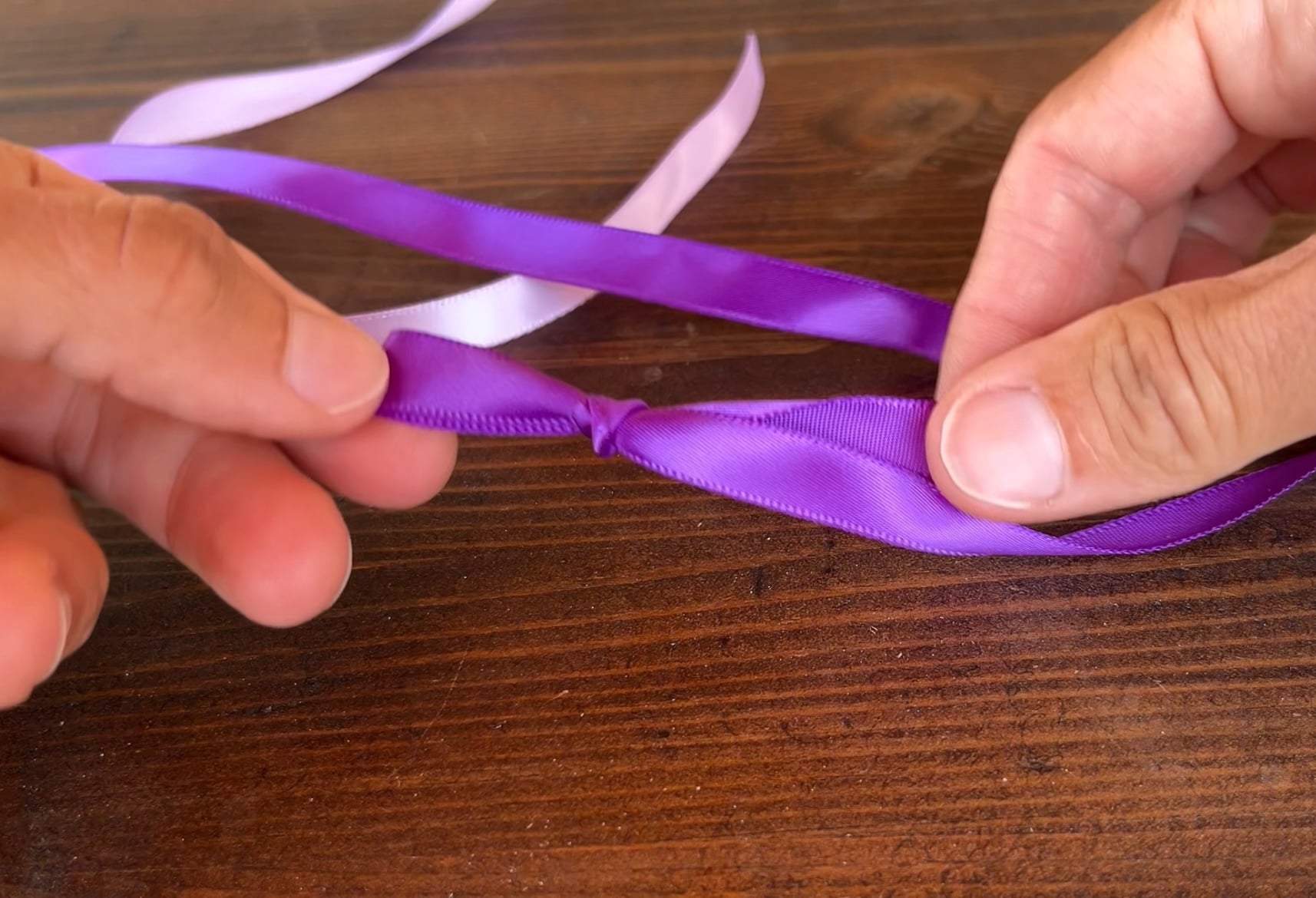 a slip knot ina. piece of ribbon