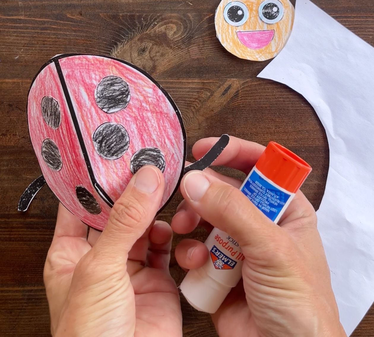 gluing legs on paper 3d ladybug craft