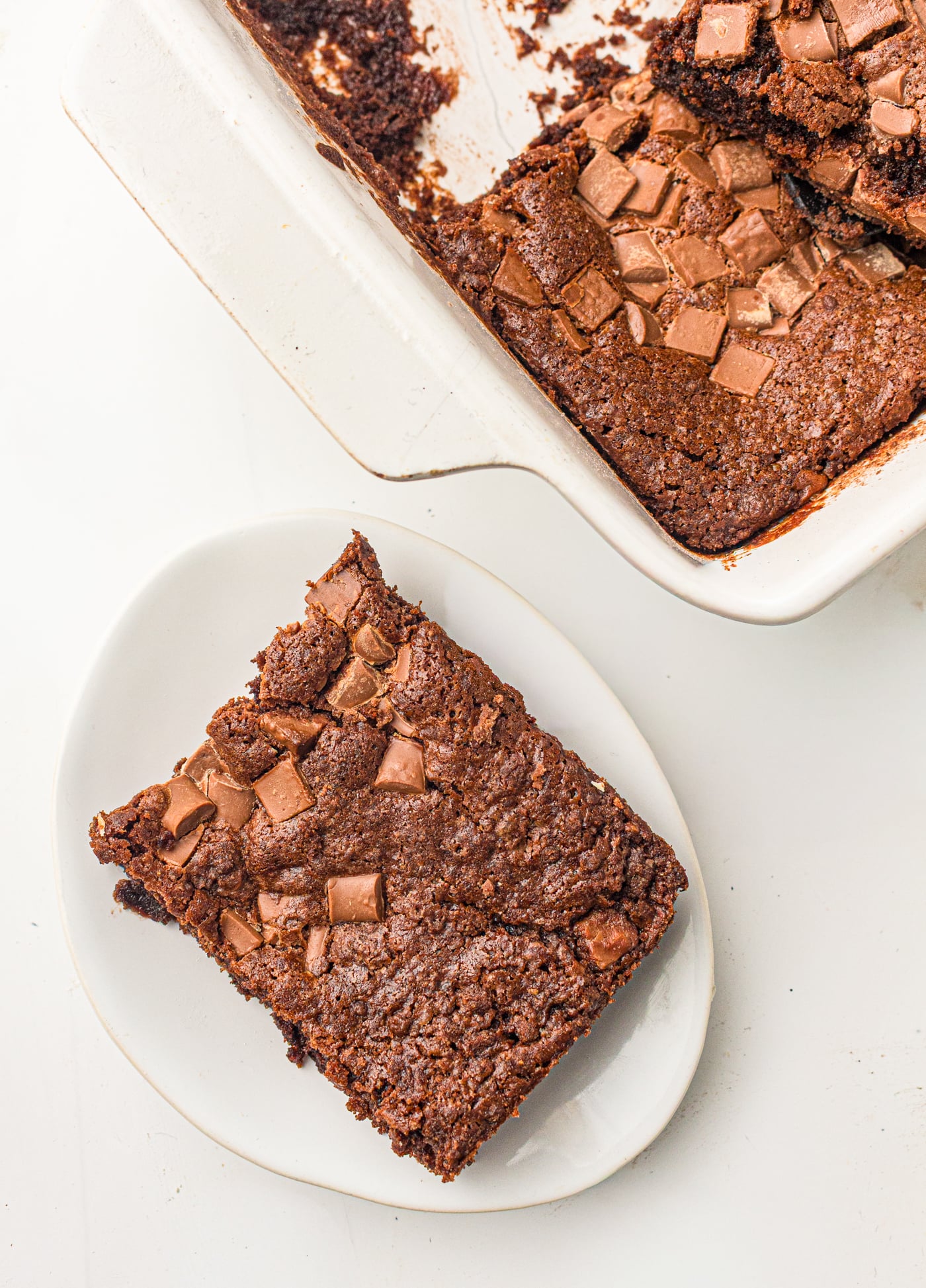 a top down view of a slice of double chocolate dump cake removed from a pan
