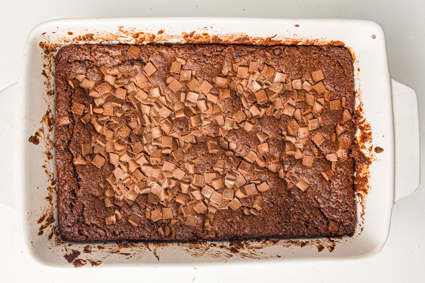 baked chocolate dump cake in a white baking dish