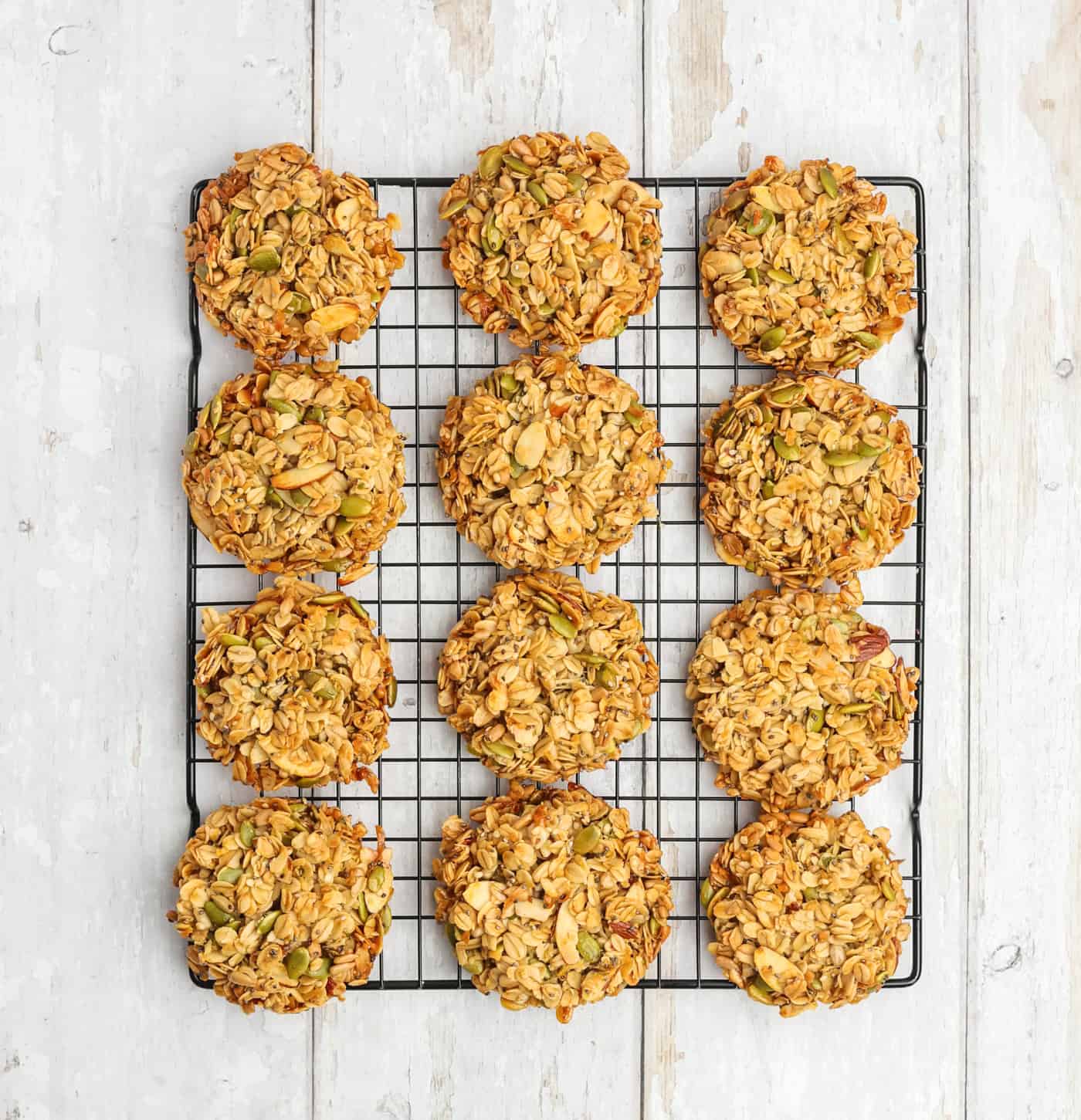 a wire cooking rack with baked granola cookies