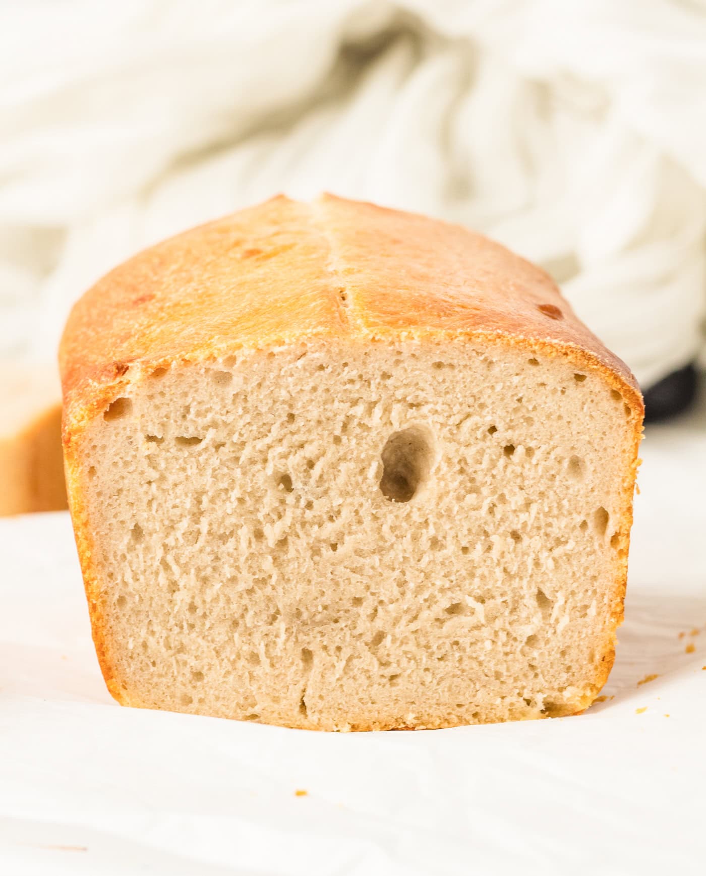 a photo of a sliced loaf of sourdough sandwich bread